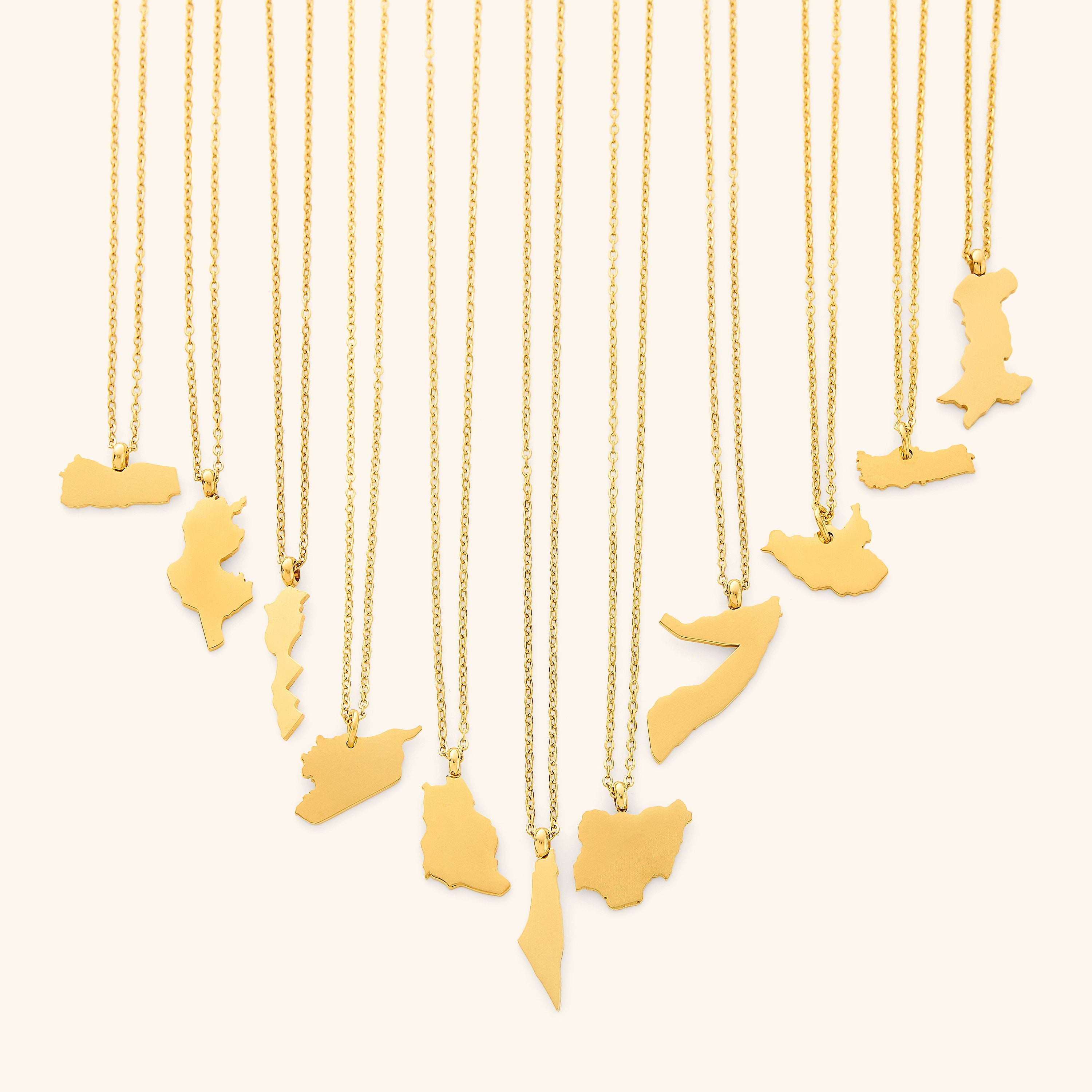 Close-up of the personalized country map necklace showcasing its intricate design and gold finish.