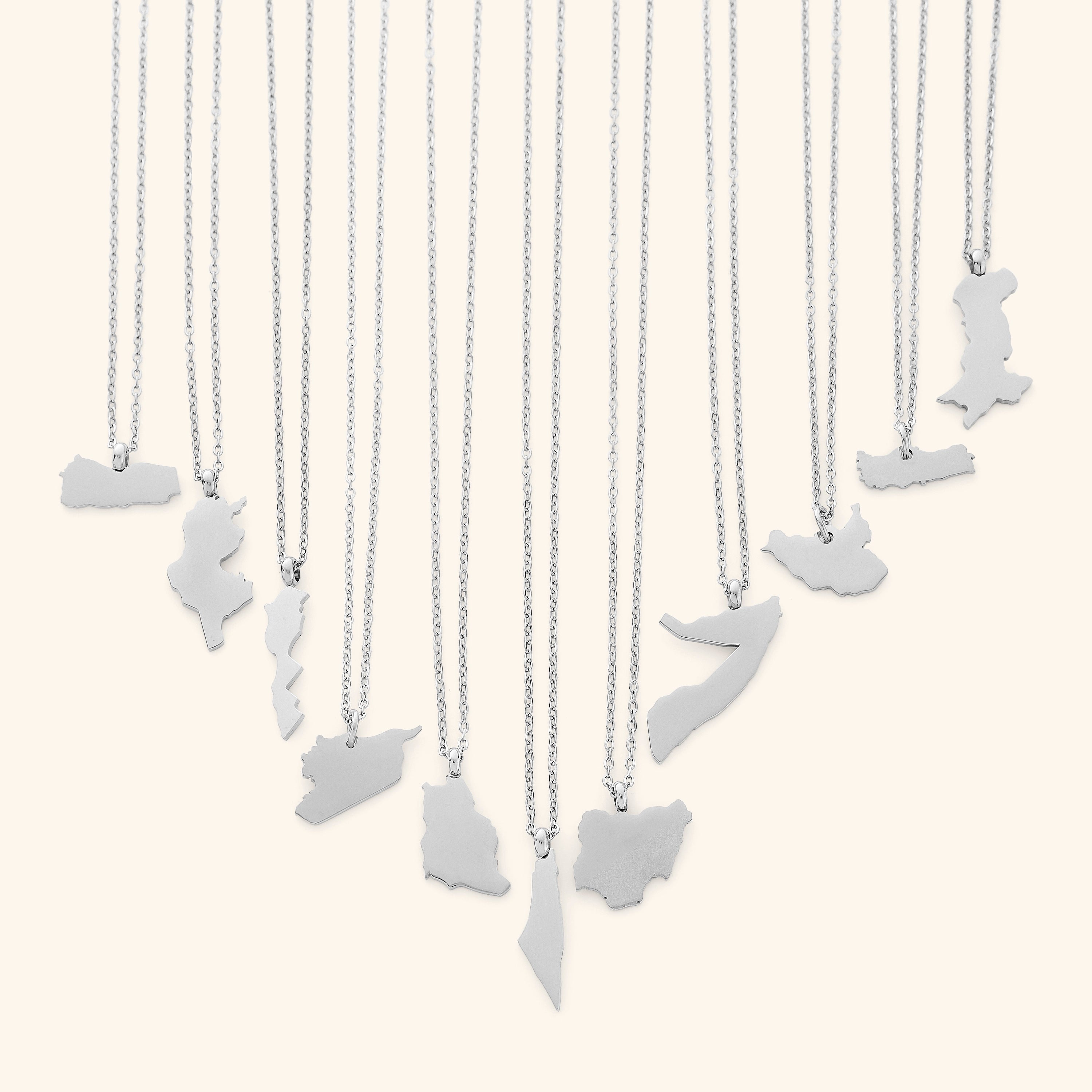 A woman wearing the map necklace, demonstrating its stylish appeal in a casual setting.