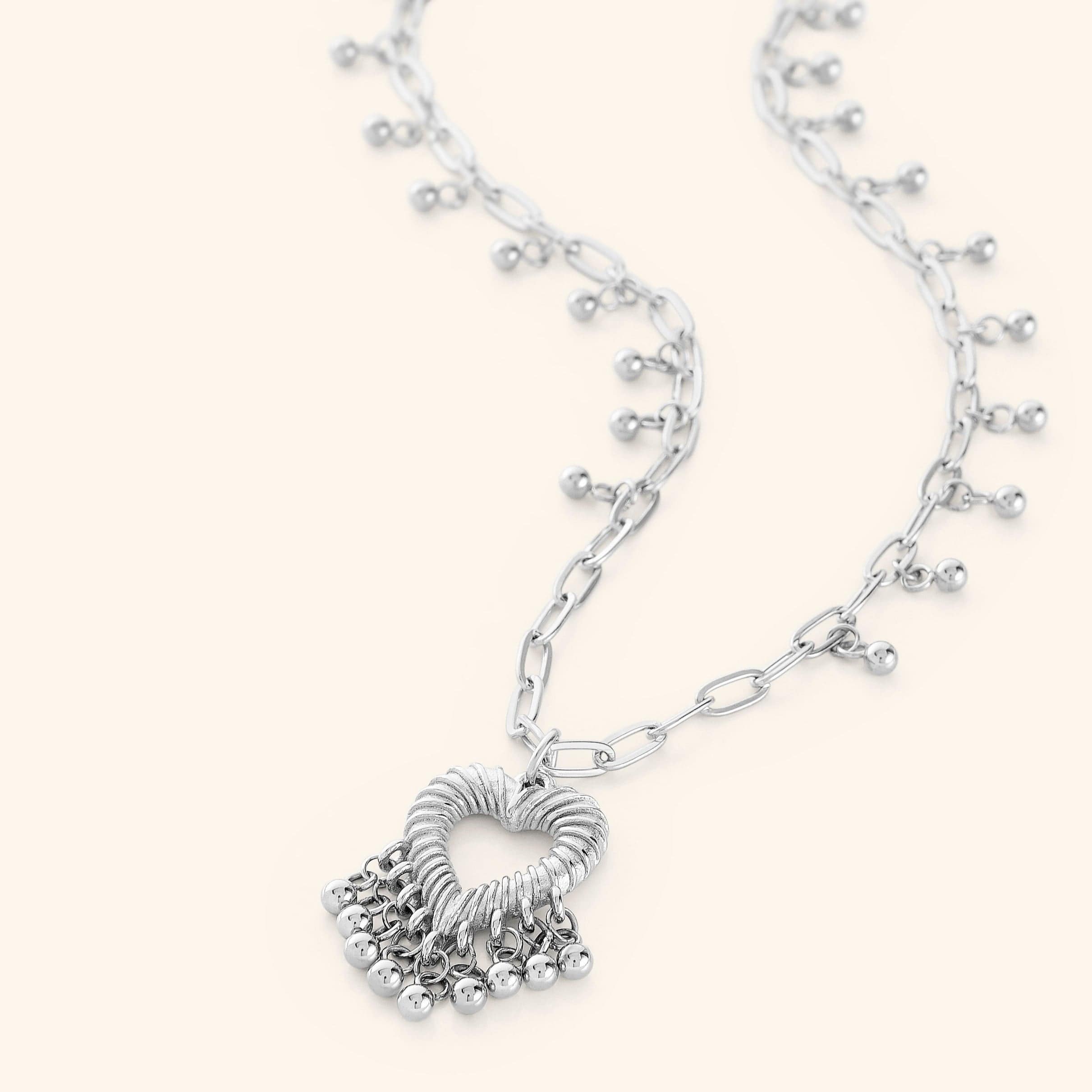 Model wearing the Ethereal Love Necklace, showcasing its elegance and movement.