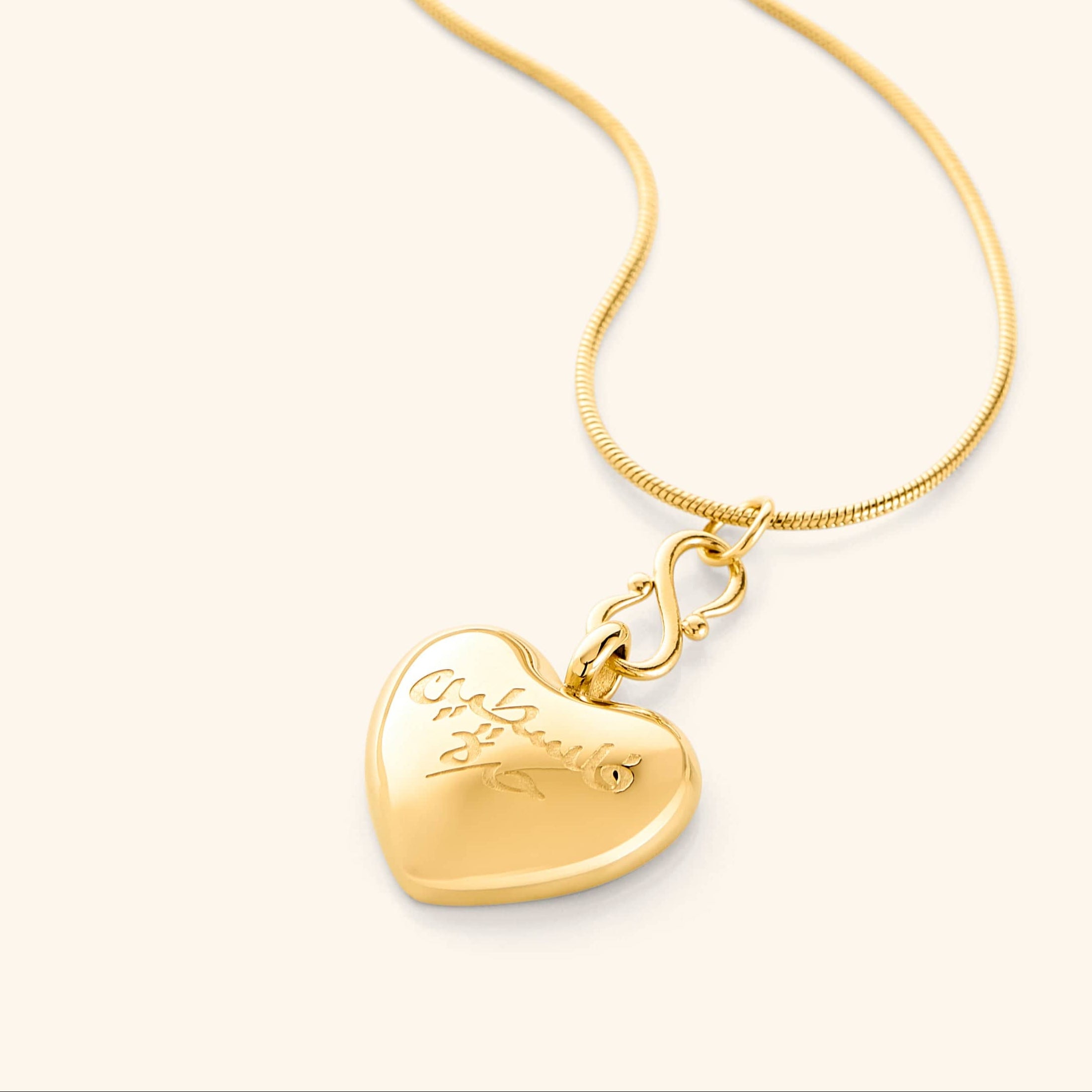 Solidarity heart necklace displayed on a velvet pouch, showcasing its elegant design.