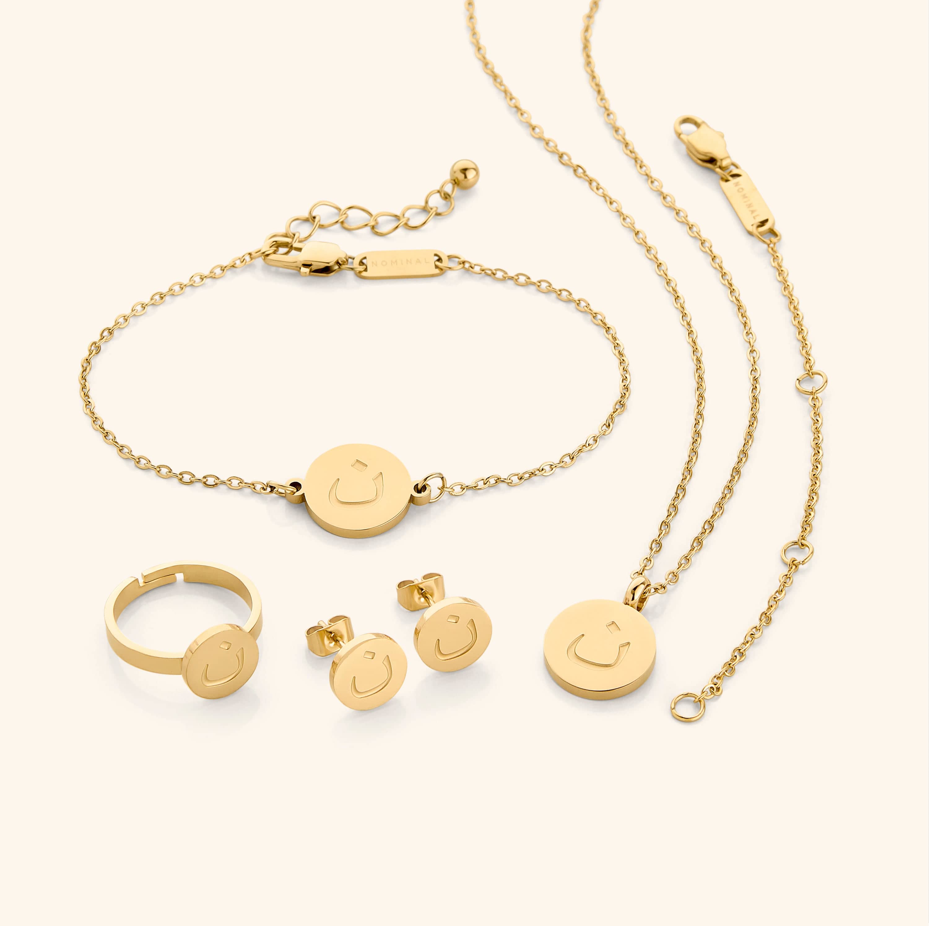 Stylish Arabic letter earrings designed for special occasions, elegantly packaged.