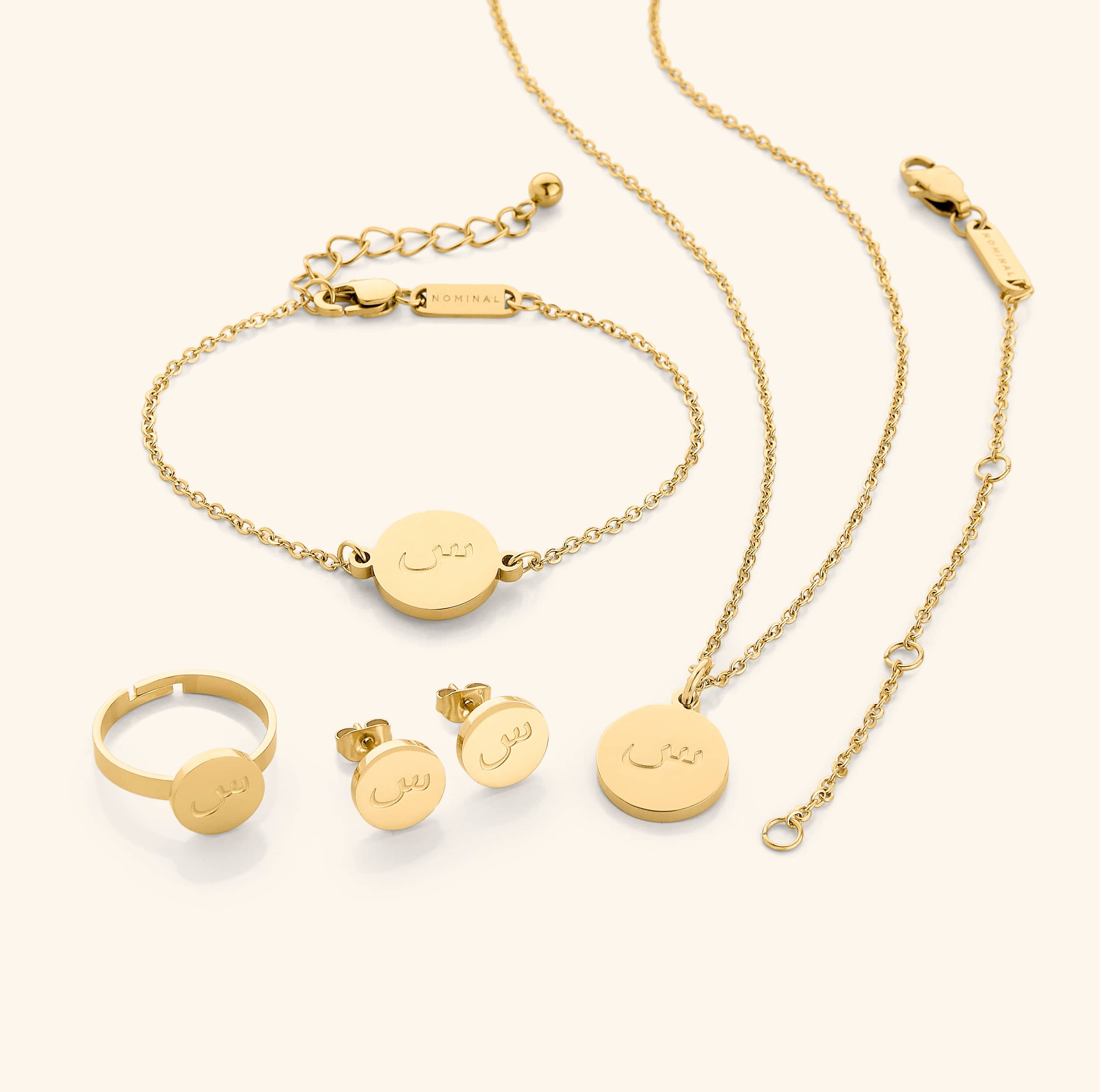 Elegant Arabic letter necklace displayed with a gold finish, perfect for gifts.