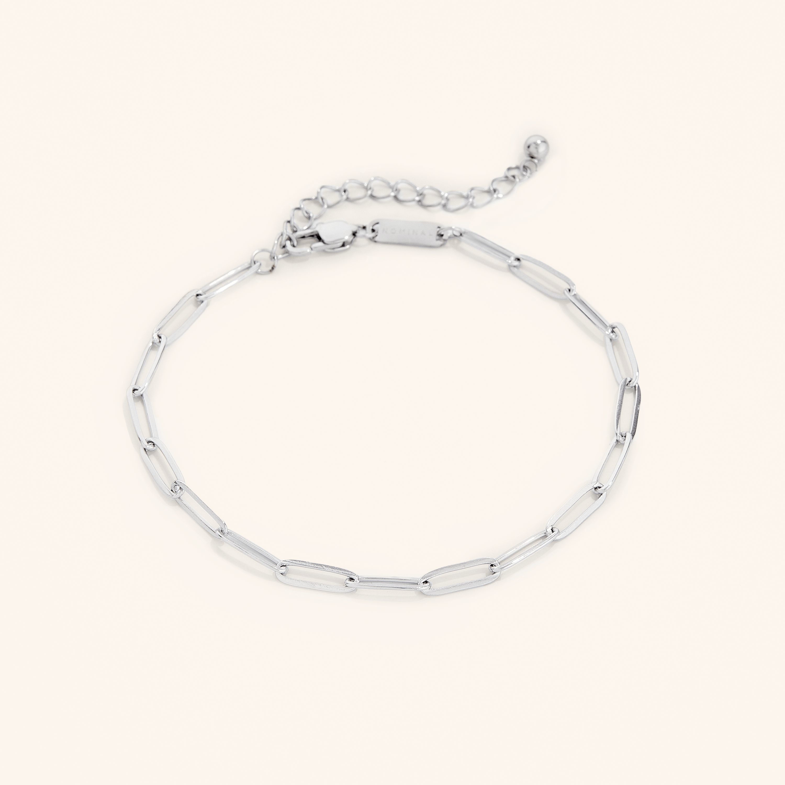 Elegant gold chain anklet displayed on a models ankle, highlighting its delicate design and fit.