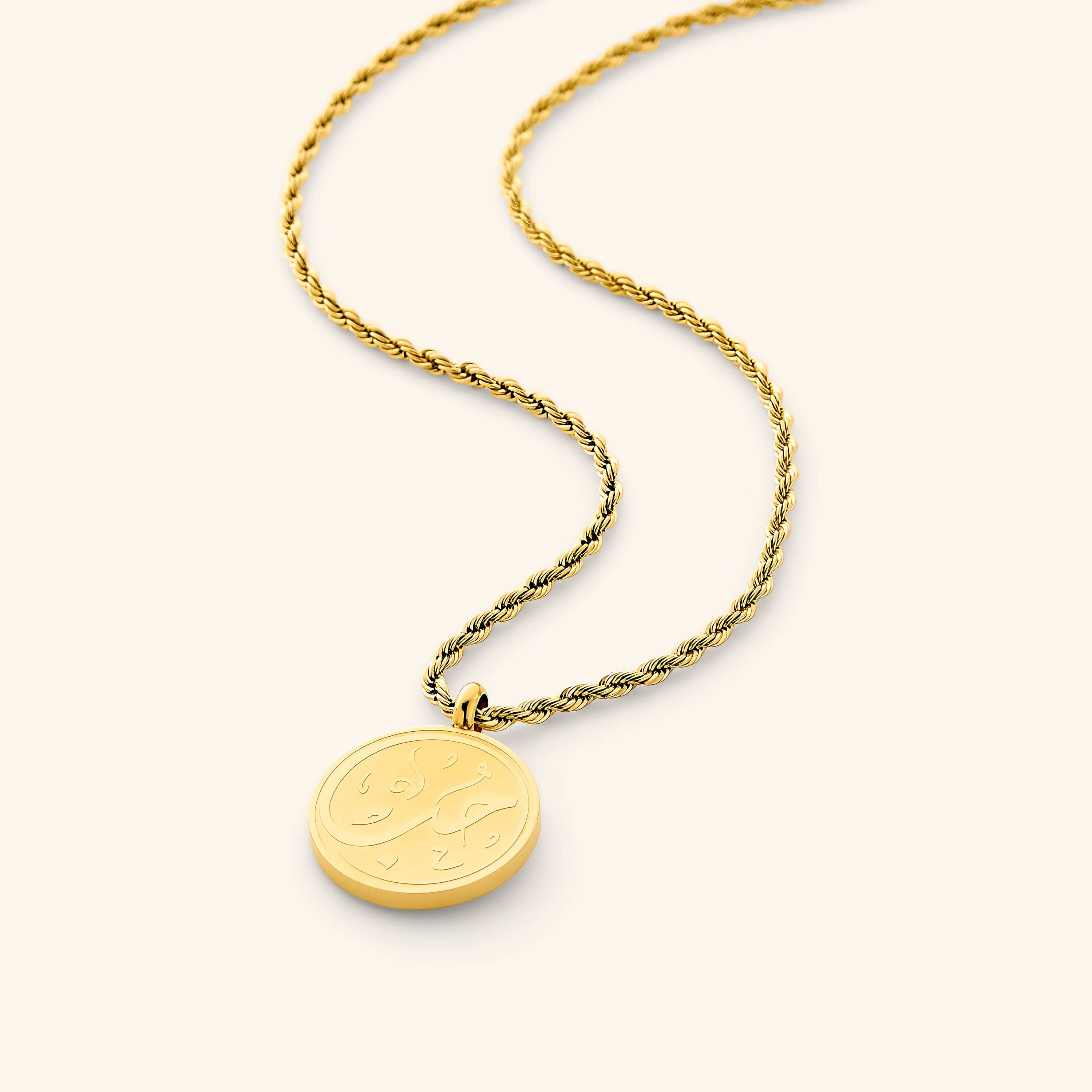 Close-up of the Eternal Love Token Necklace displaying the intricate Arabic calligraphy design.