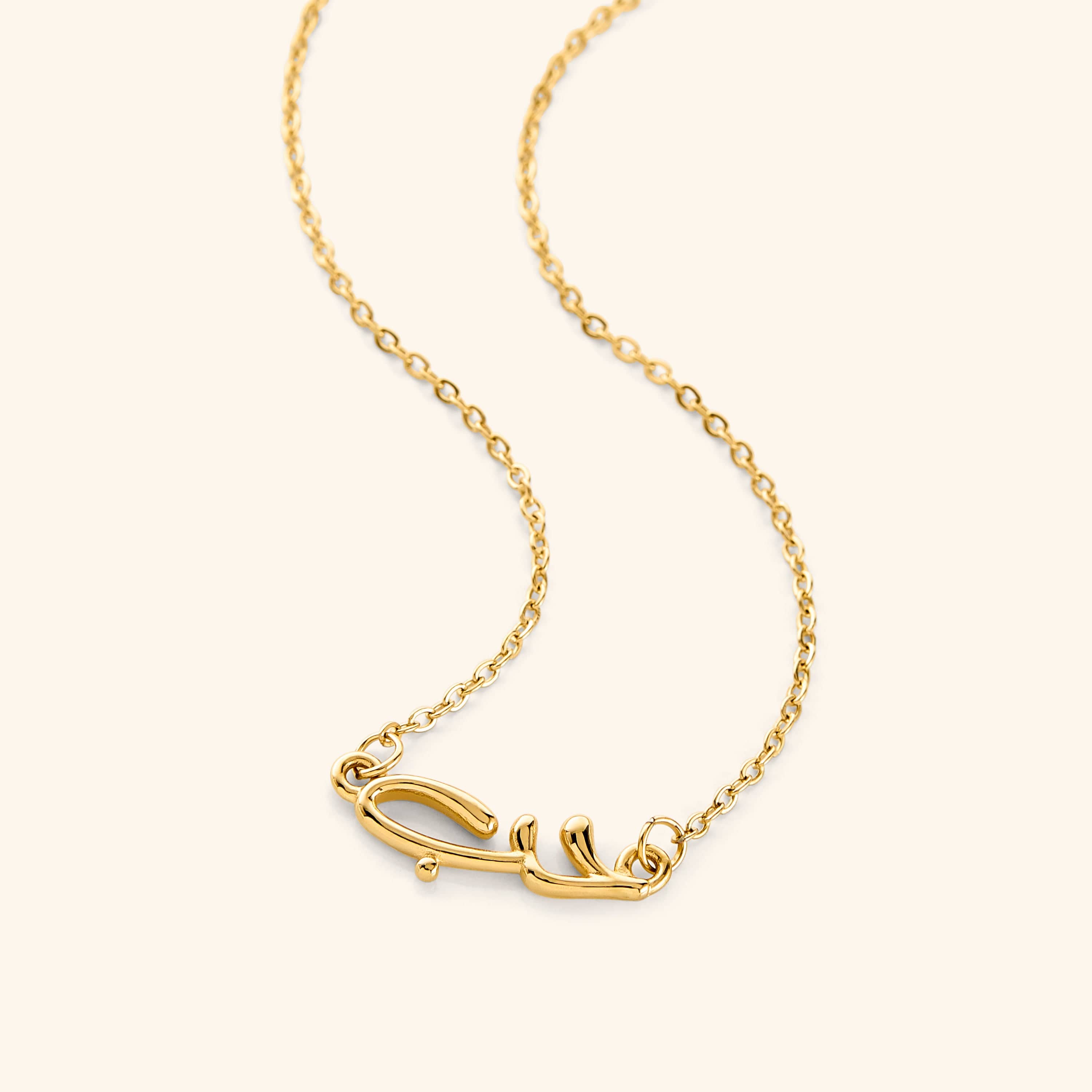 Close-up of the Arabic love bubble necklace showcasing its shiny gold plating and intricate design.