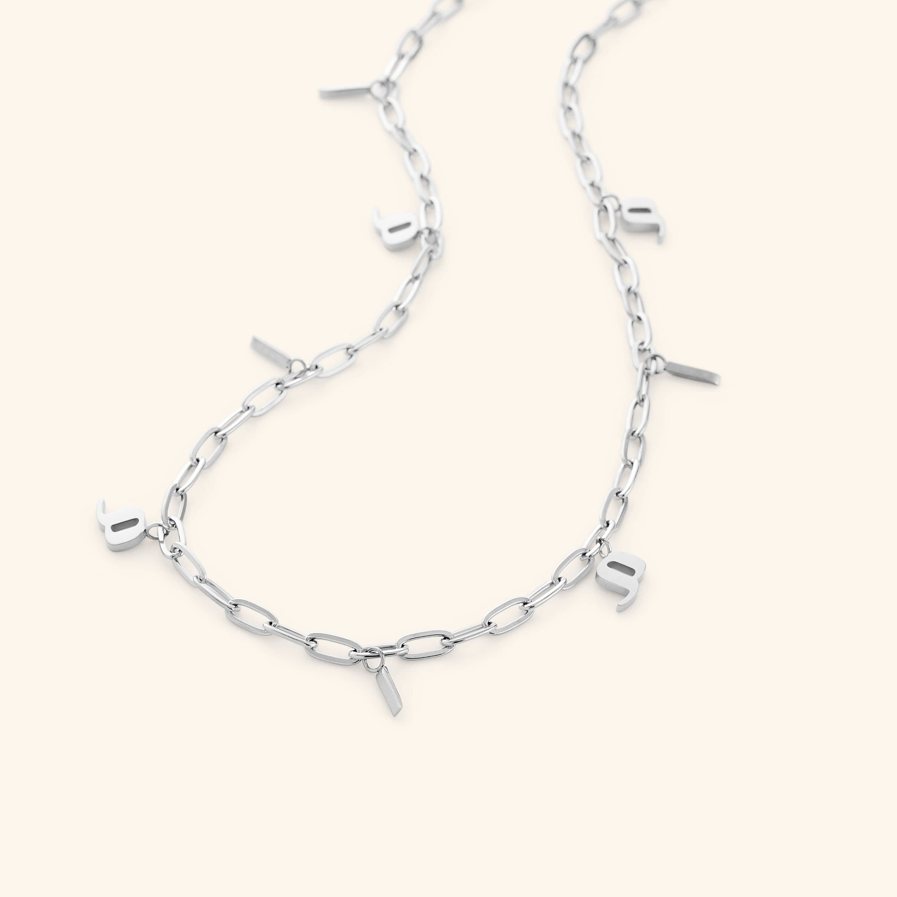 A woman wearing the personalized mama charm necklace, highlighting its beautiful design.