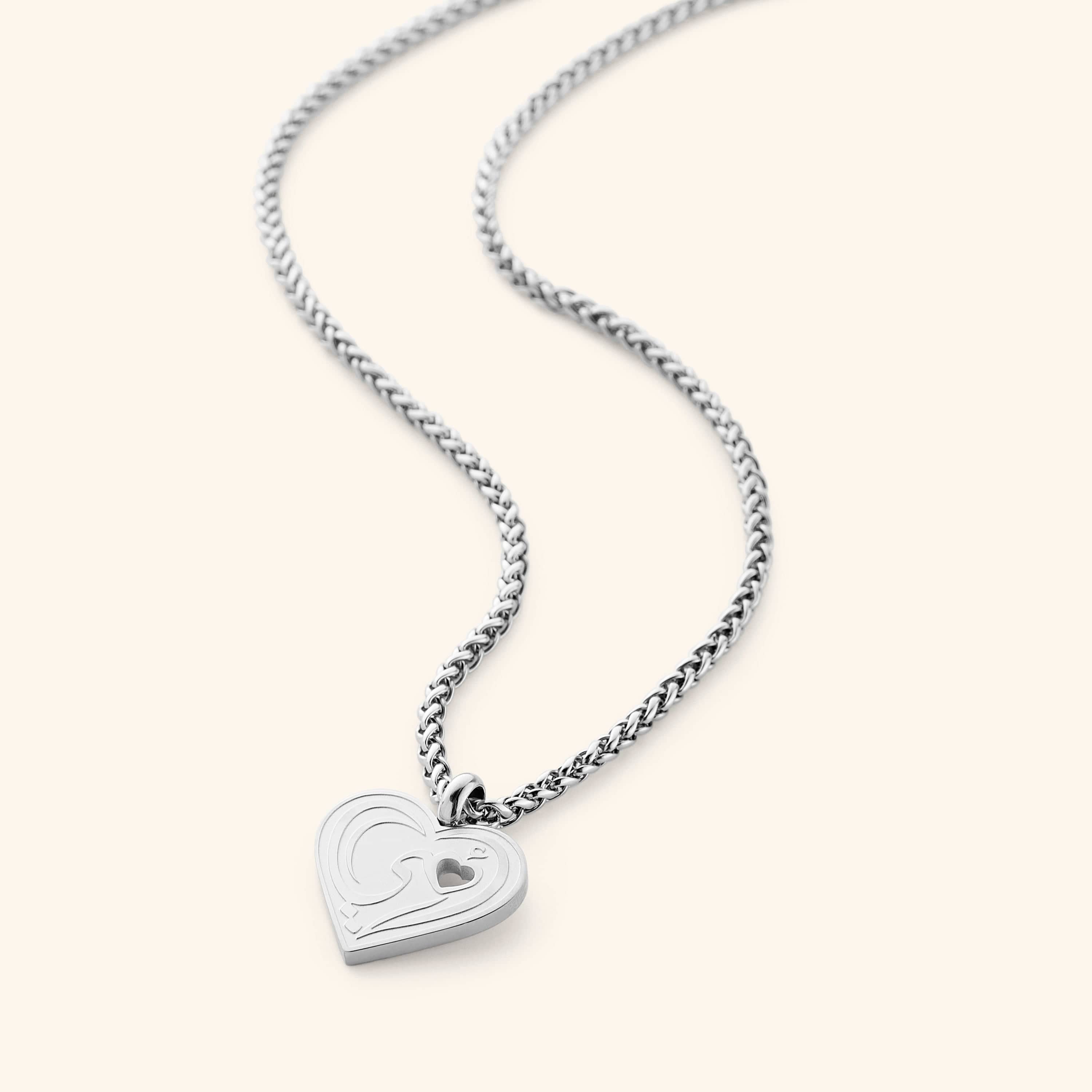 Close-up of the heart pendant on the Heartfelt Mama Necklace, highlighting the intricate design.