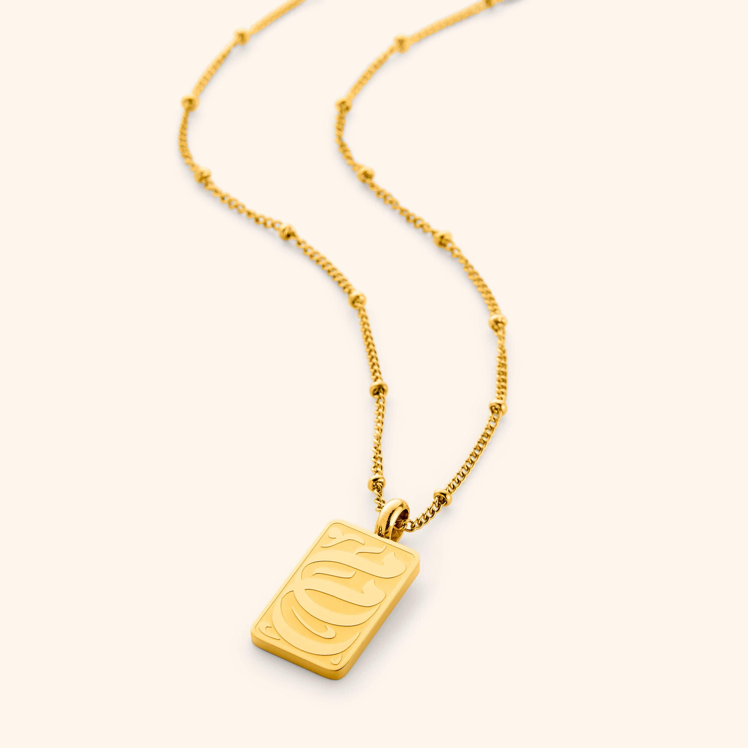 Front view of the Meaningful Mother Tag Necklace showcasing the elegant calligraphy.