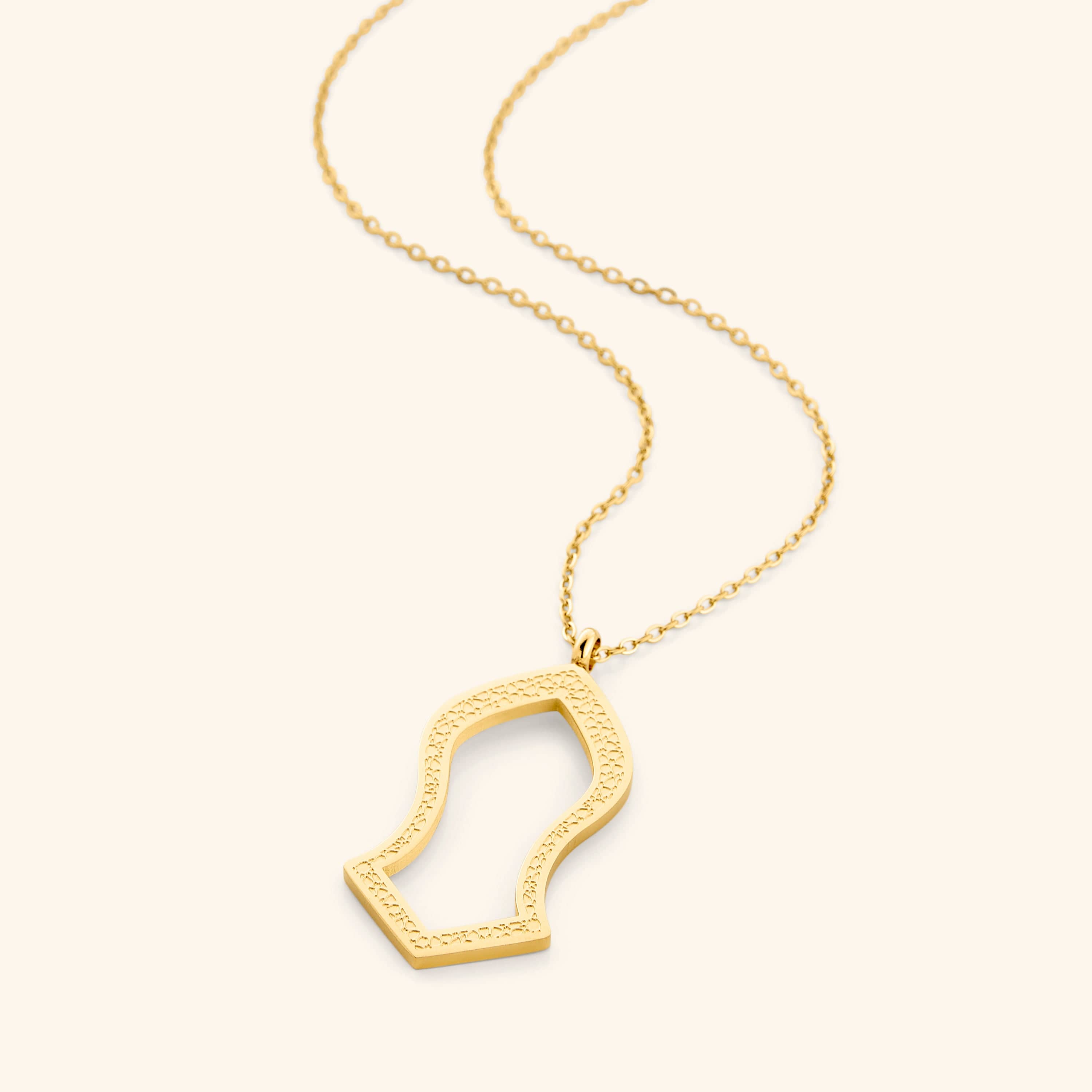 Noble Sandal Gold Pendant Necklace displayed on a velvet pouch, highlighting its intricate design.