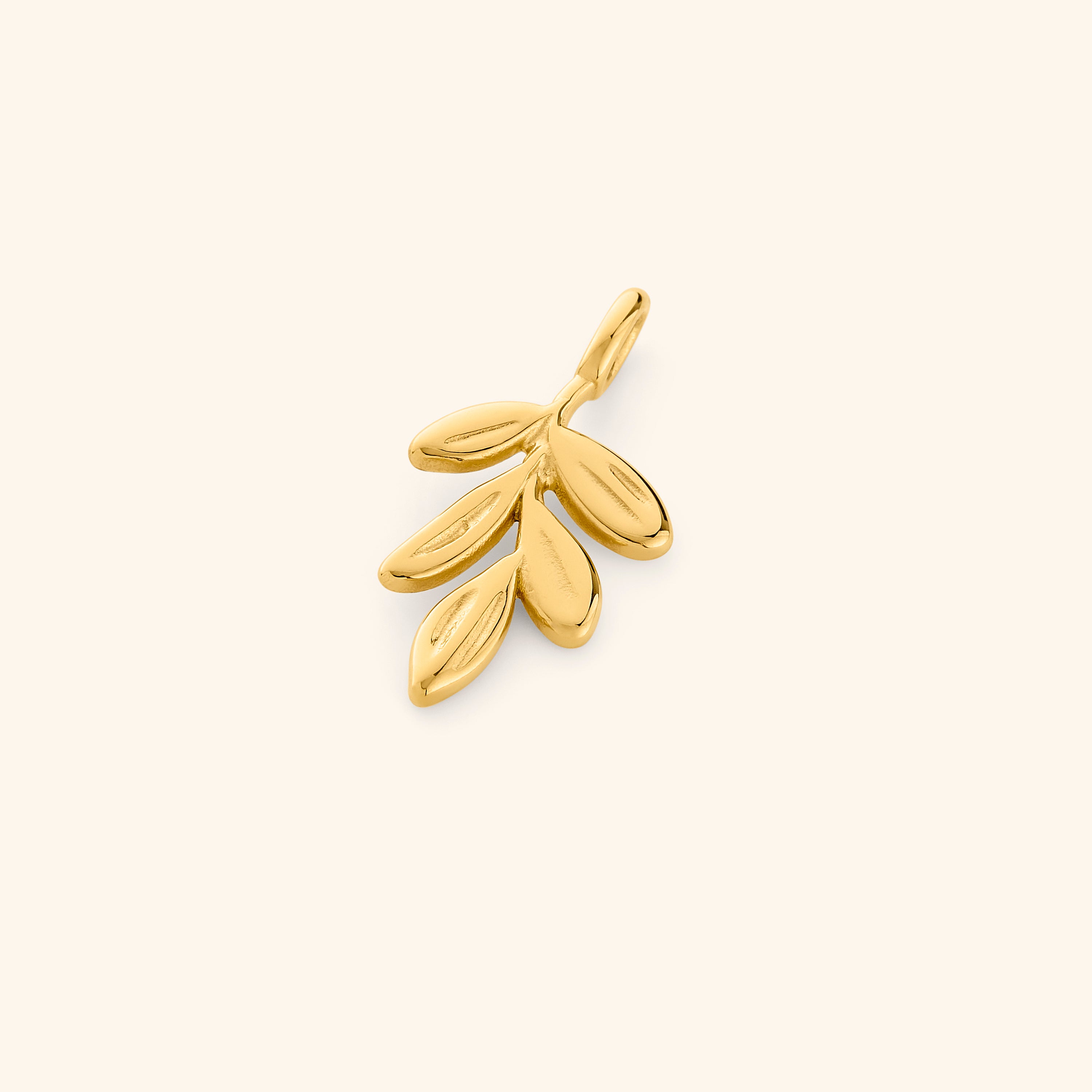Close-up of the Timeless Olive Branch Gold Charm highlighting its intricate design.
