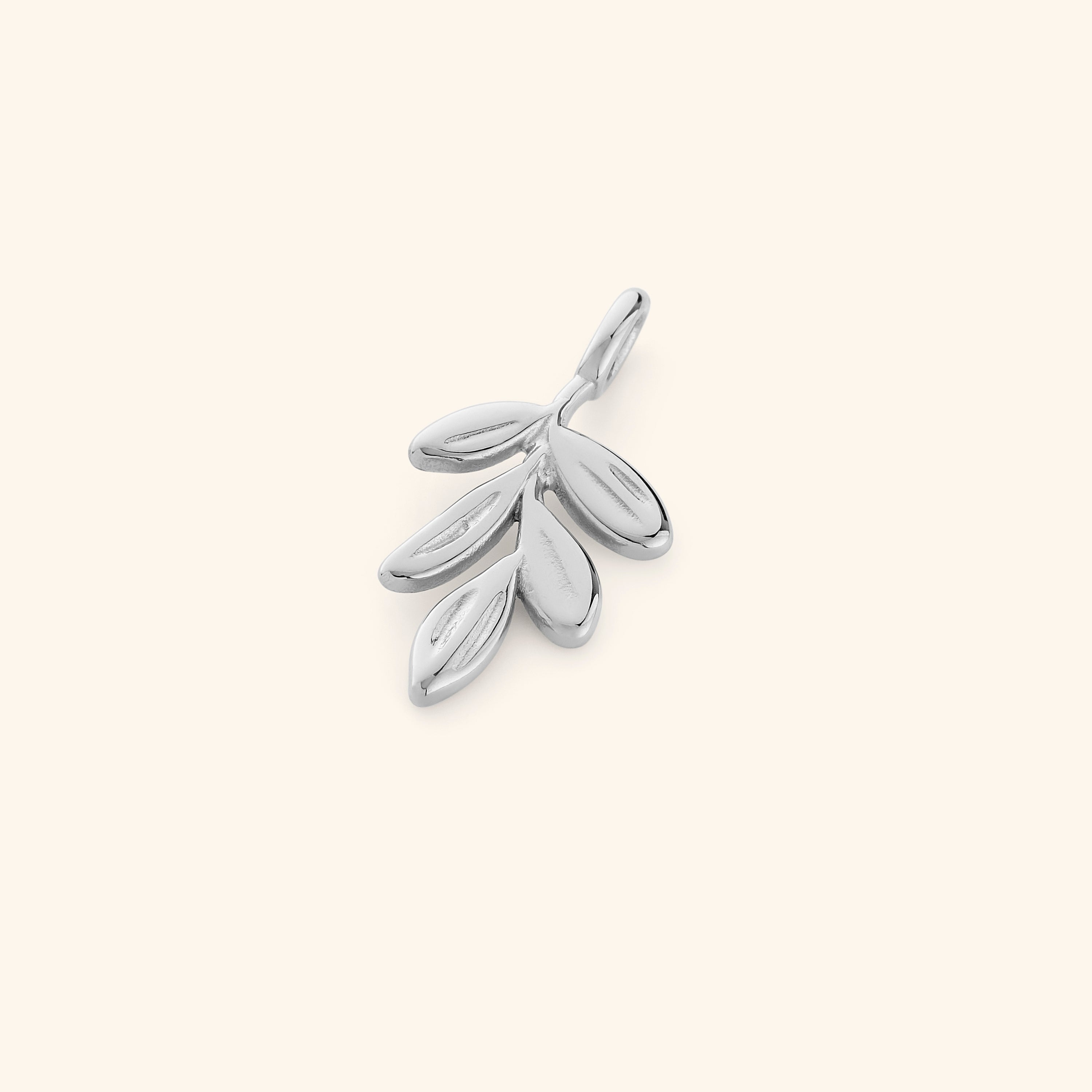 Olive branch charm displayed on a necklace, showcasing its elegance and symbolism.