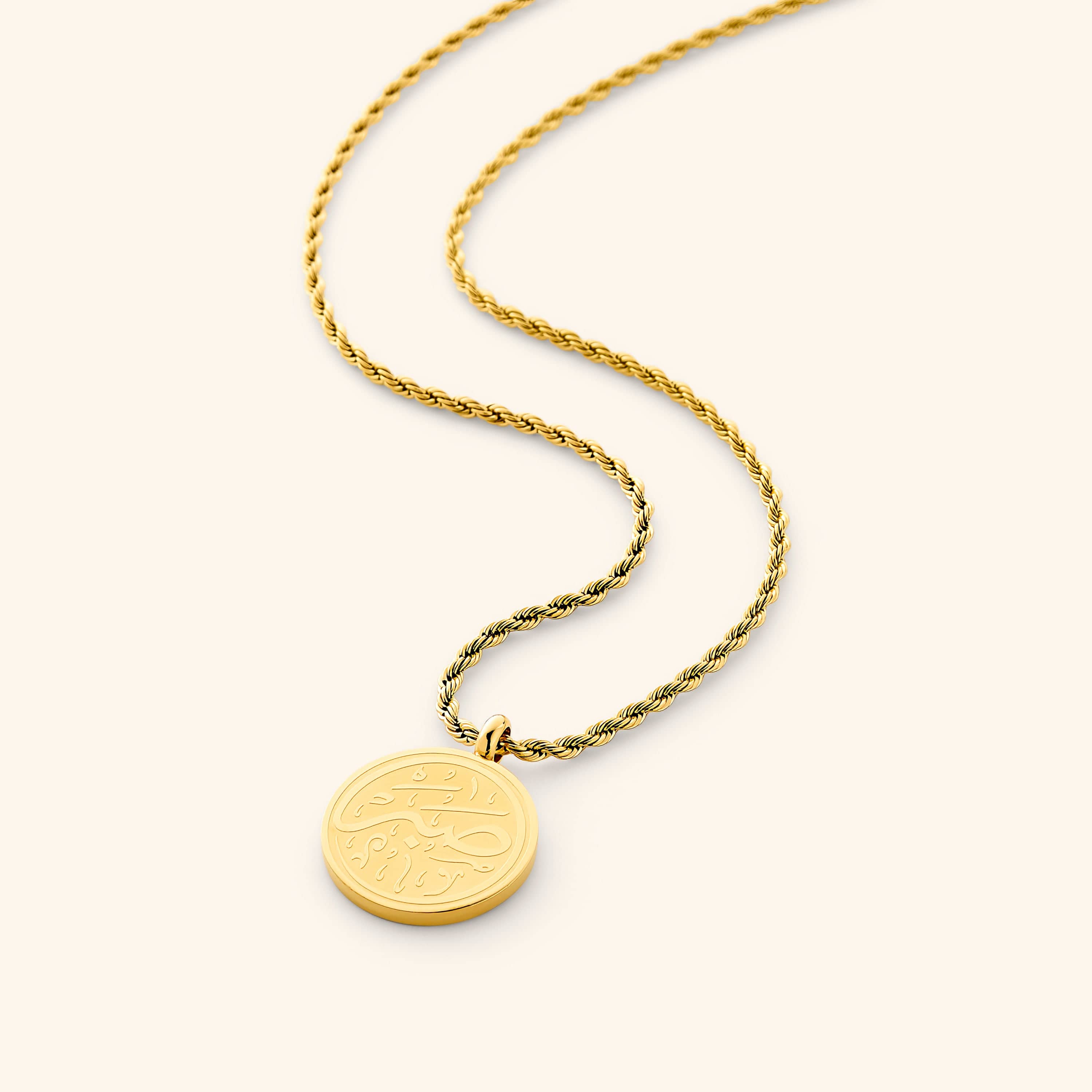 Close-up of the Arabic calligraphy patience necklace showcasing intricate details.