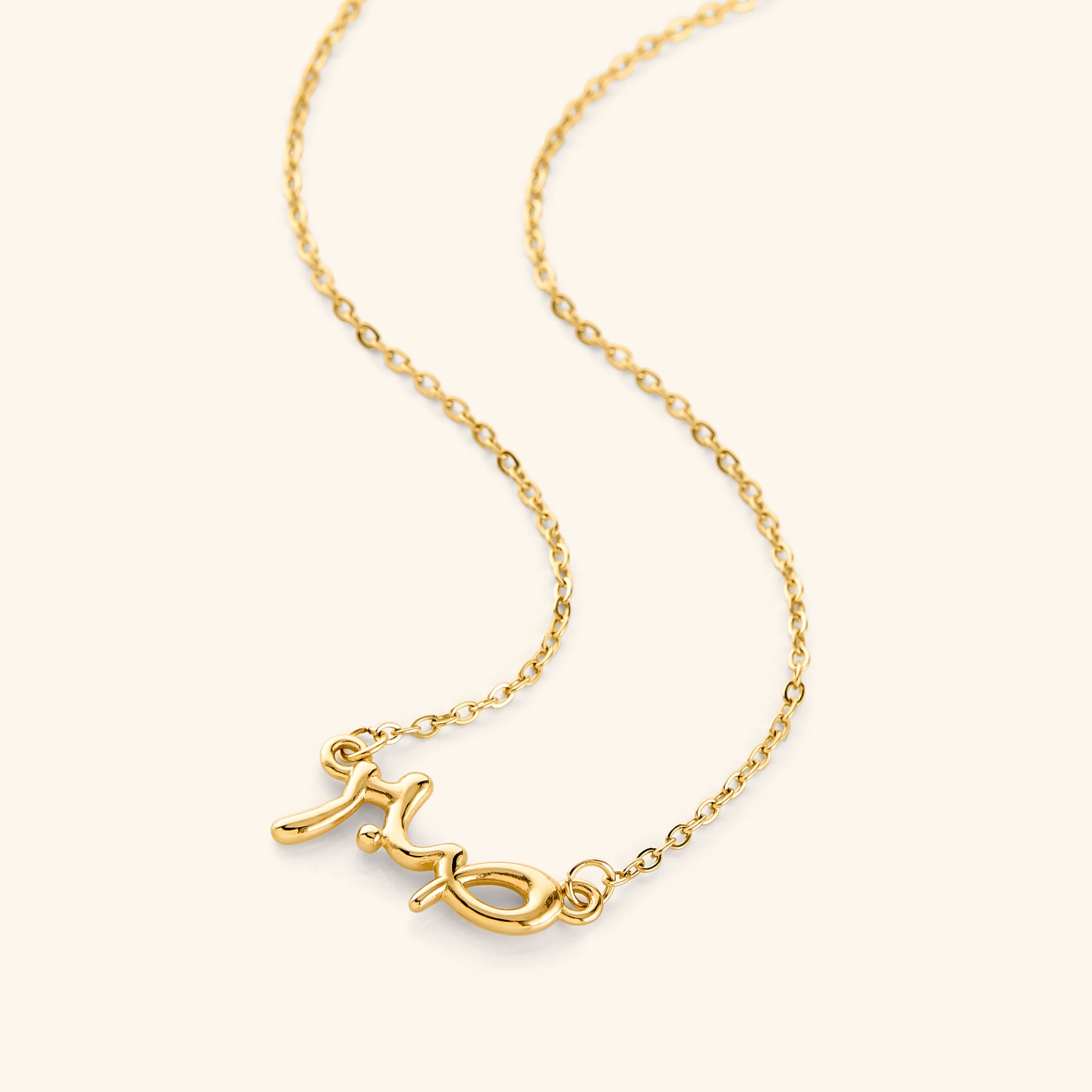 Close-up of the Arabic calligraphy bubble necklace highlighting the word Sabr.