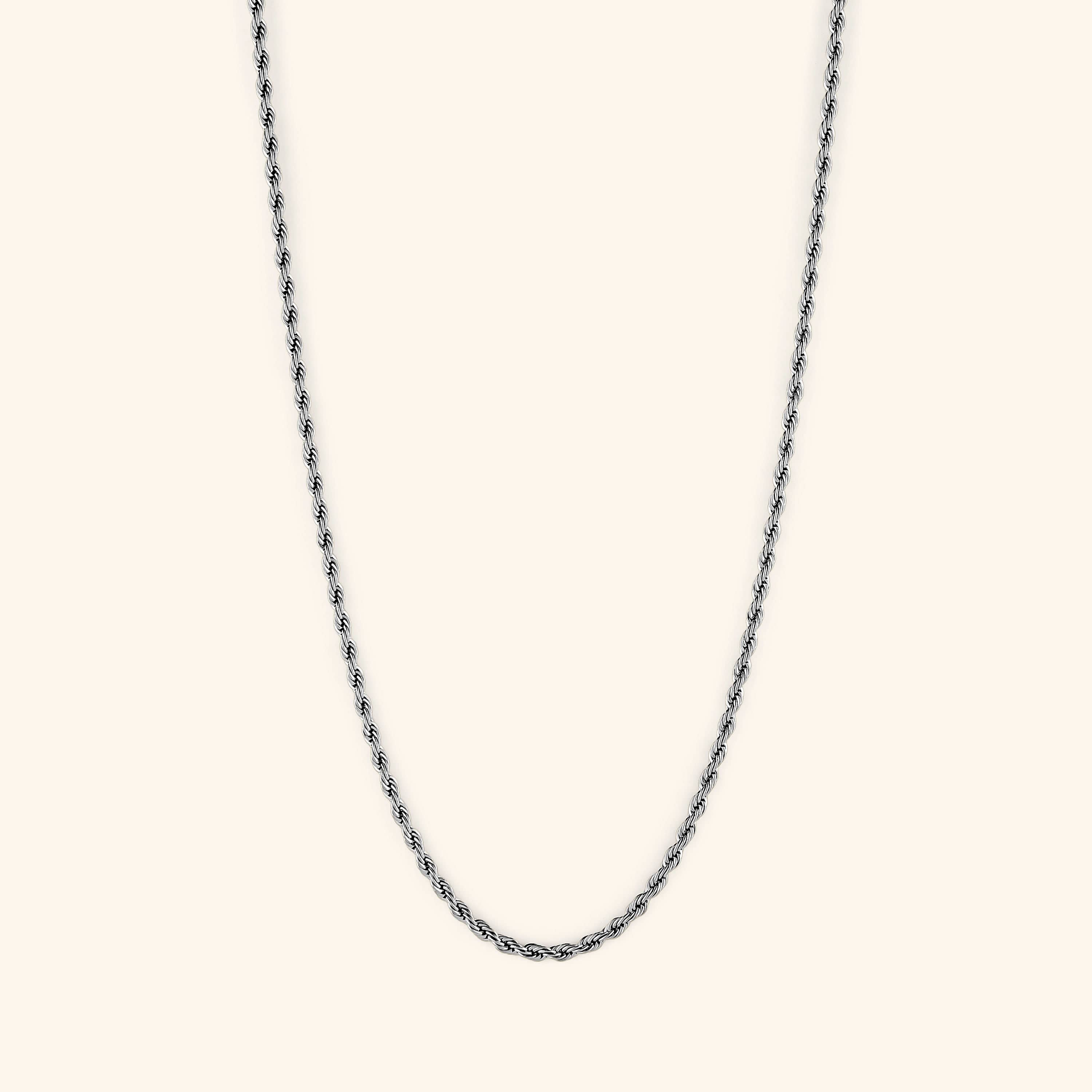 Product packaging showing velvet pouch and gold rope chain necklace elegantly placed