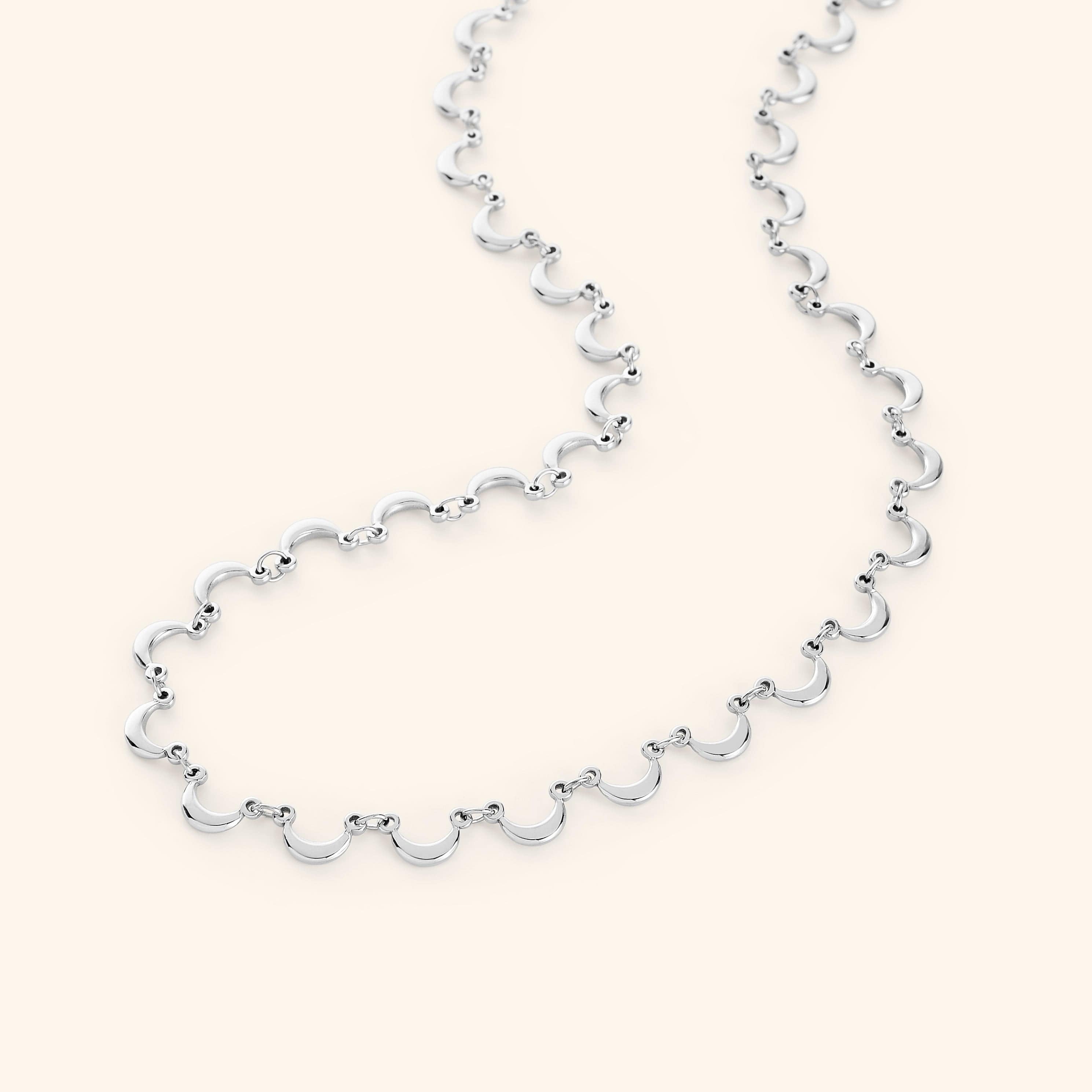 Close-up of the golden moons on the Celestial Elegance Necklace.