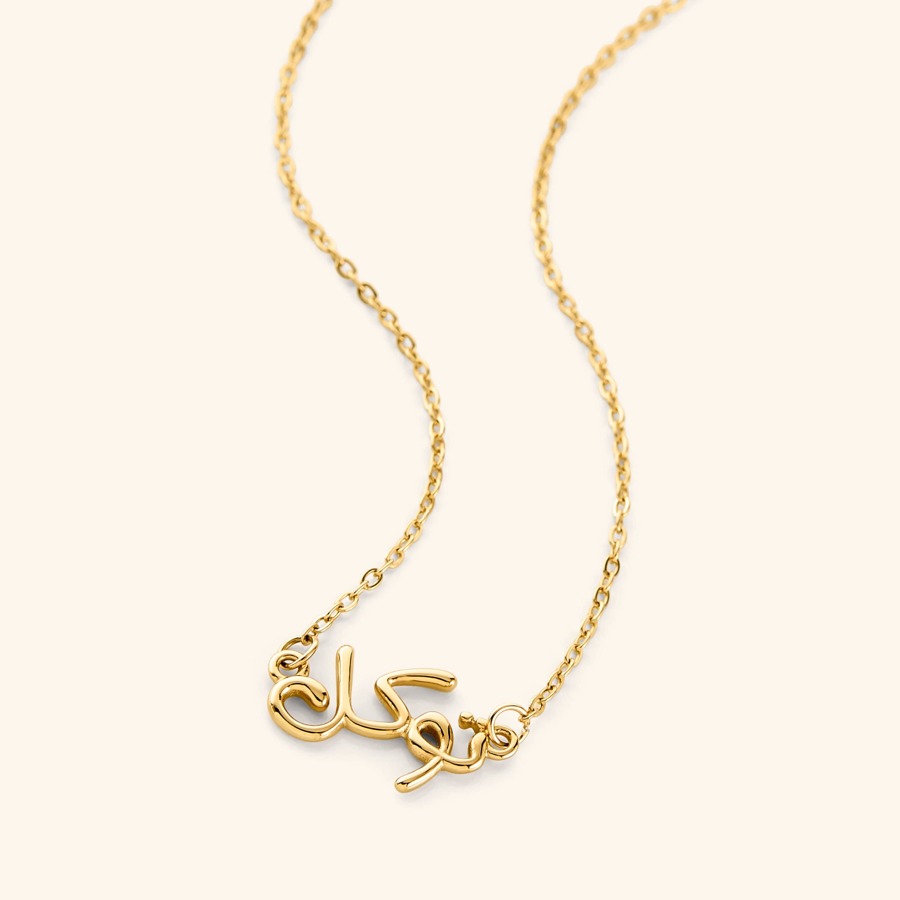 Close-up of the personalized bubble necklace featuring Arabic calligraphy in a stylish bubble design.