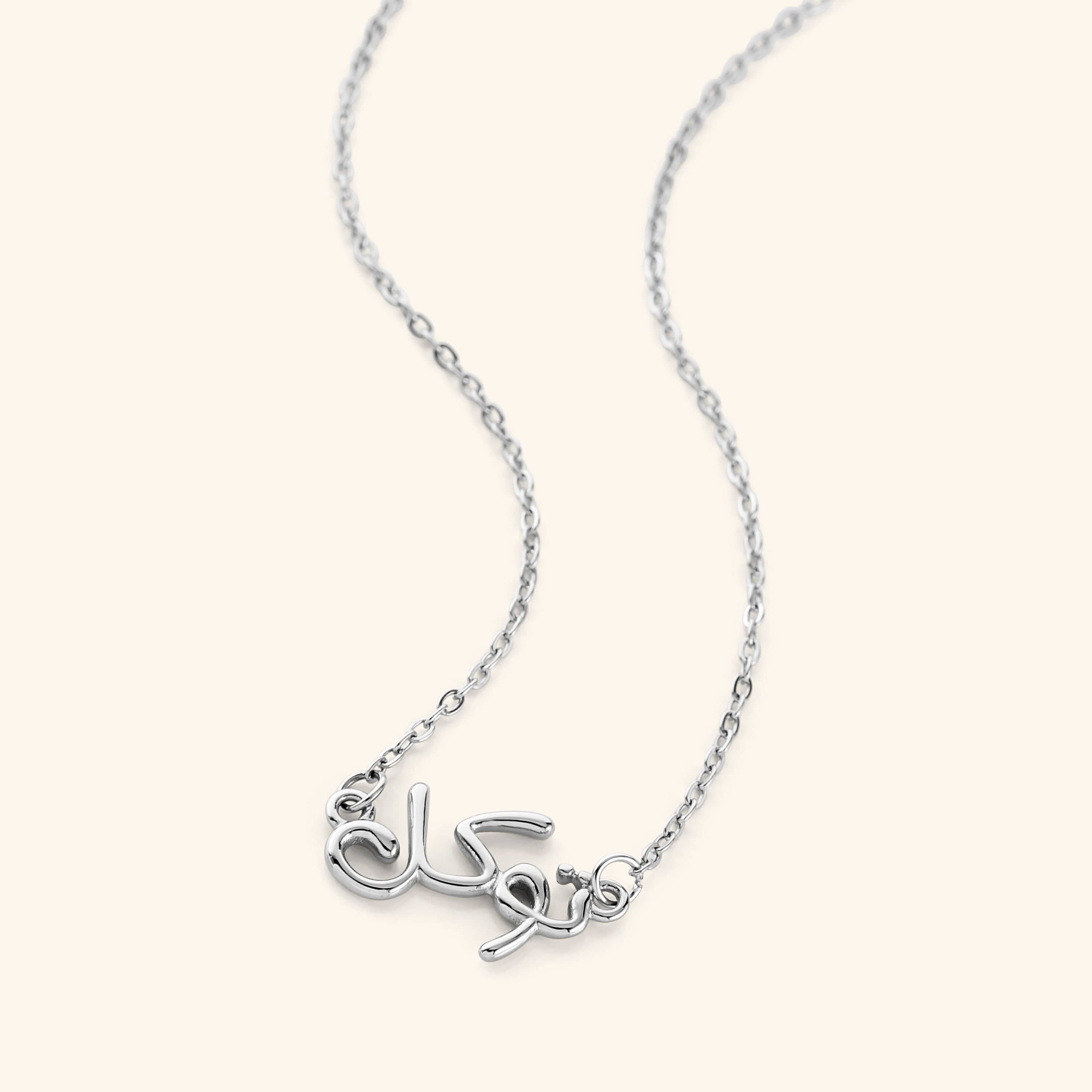 Model wearing the gold bubble necklace with Tawakkul, highlighting its elegant look.