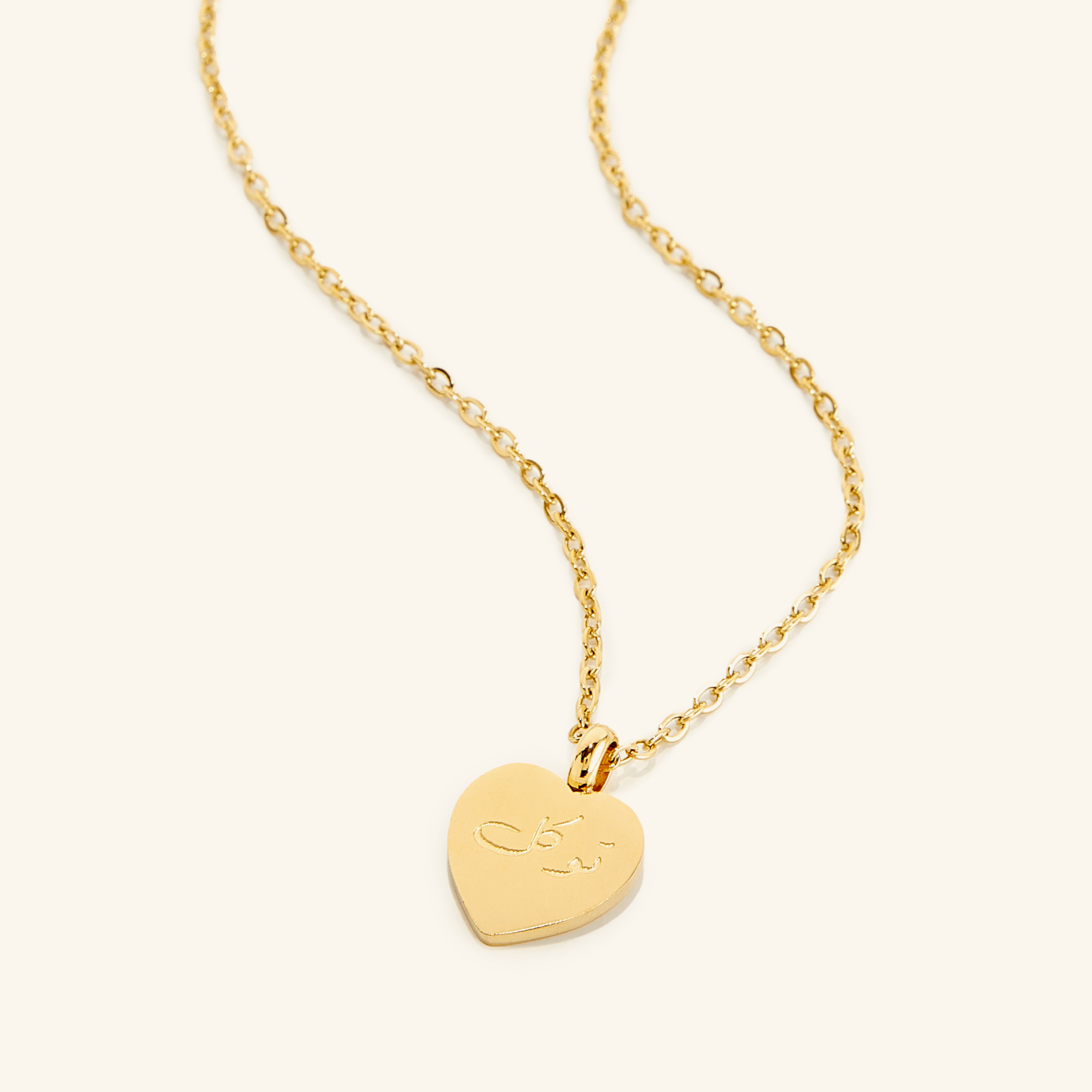 Eternal Trust Charm Necklace displayed against a soft background, highlighting its gold finish and charm.