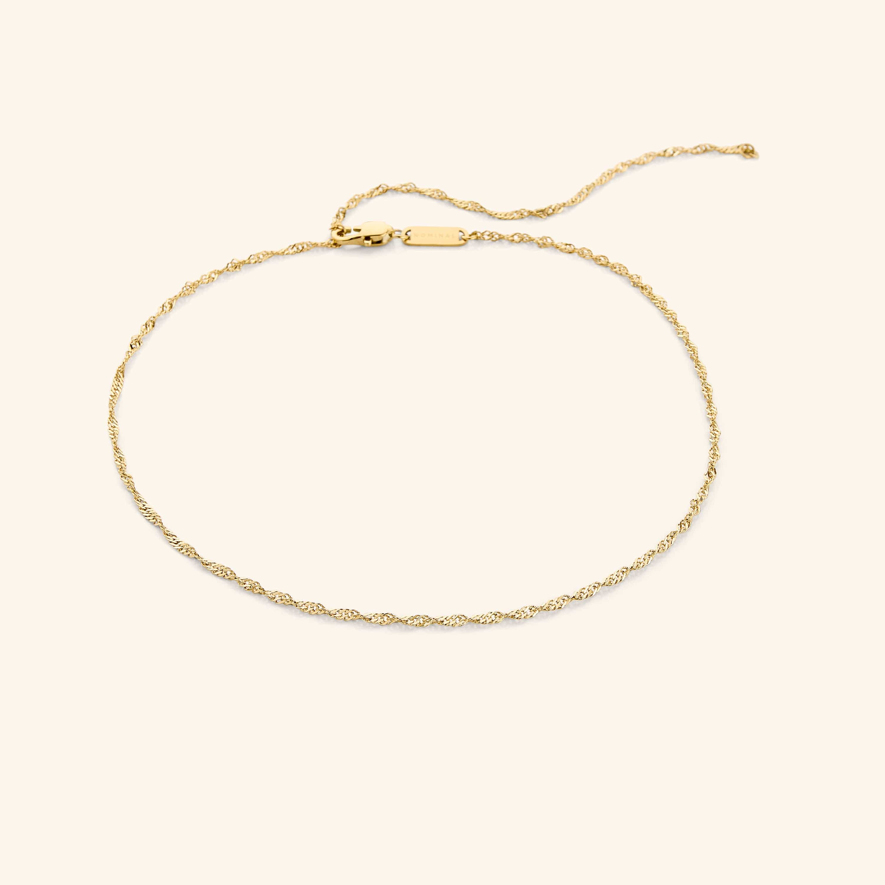 Elegant twisted chain choker necklace displayed on a mannequin.