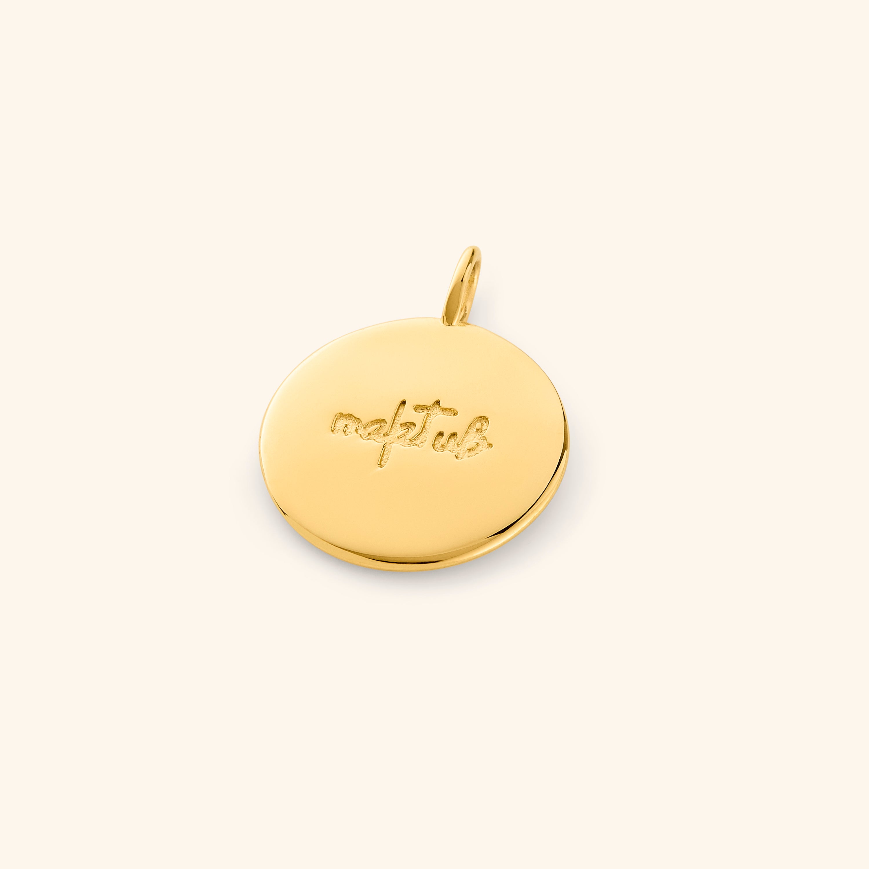 Maktub charm necklace displayed in a velvet pouch, emphasizing its gift-ready packaging.