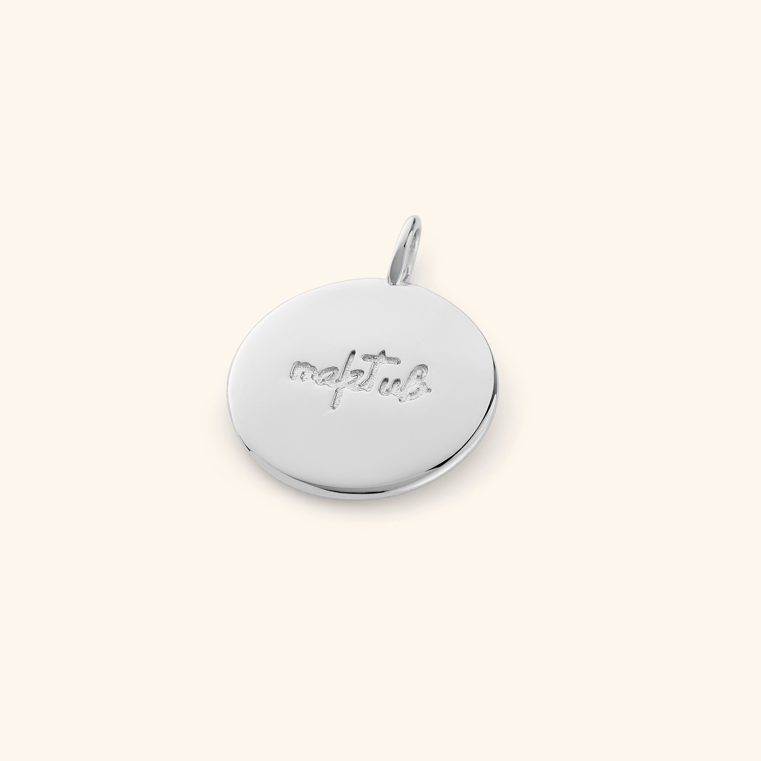 Maktub charm necklace displayed in a velvet pouch, emphasizing its gift-ready packaging.