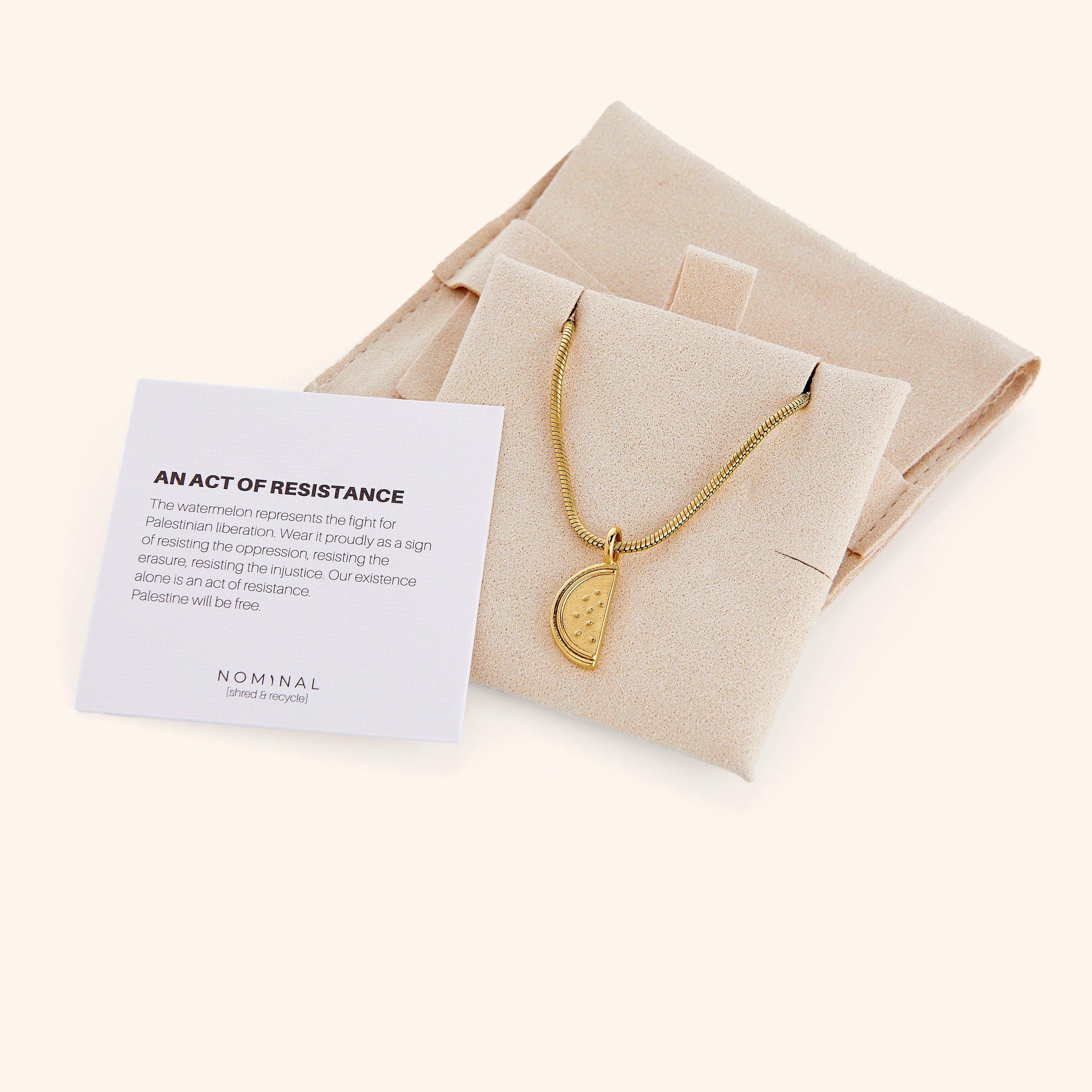 Close-up of the Palestinian watermelon necklace highlighting the intricate gold plating.