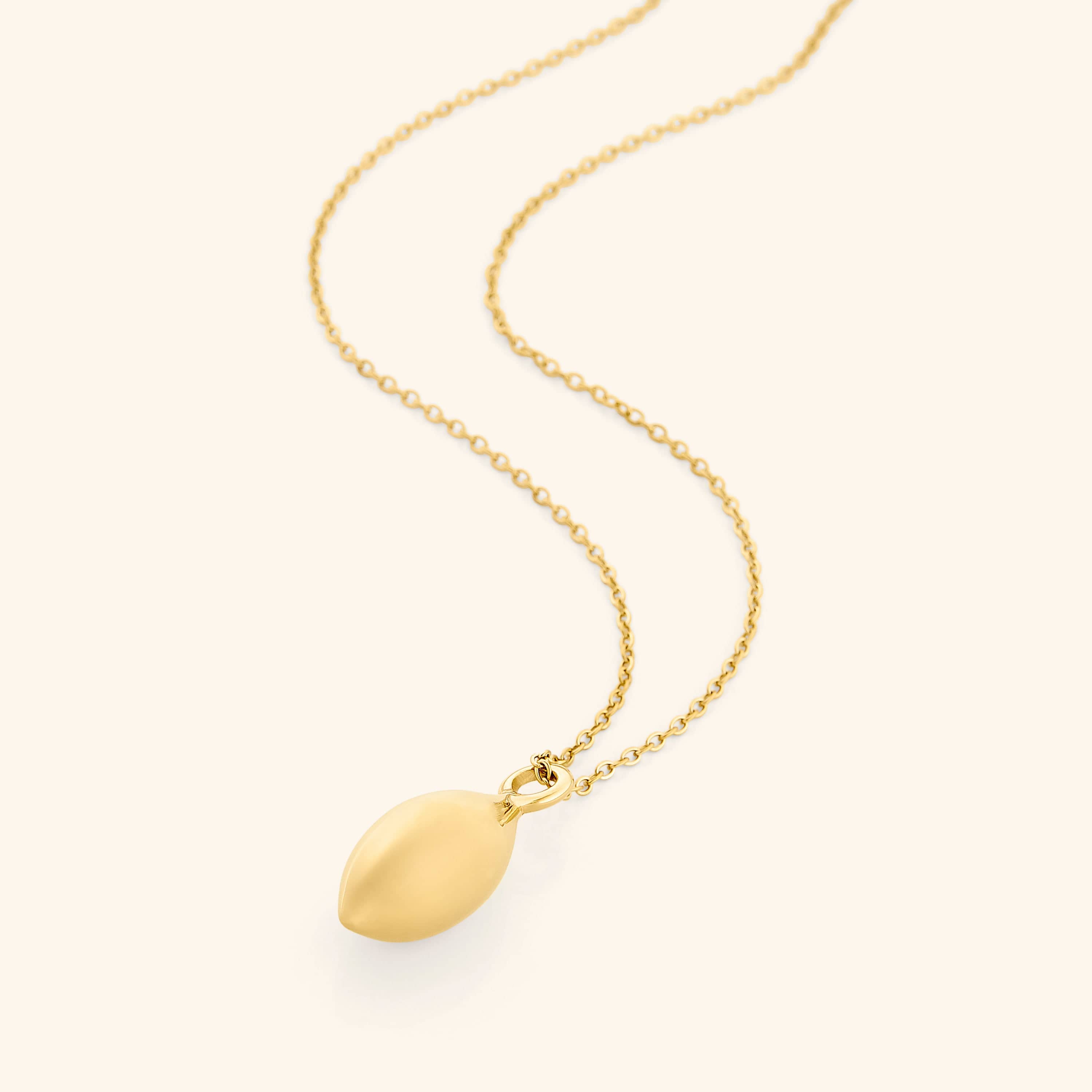 Close-up of the olive necklace showcasing its beautiful design and gold plating.