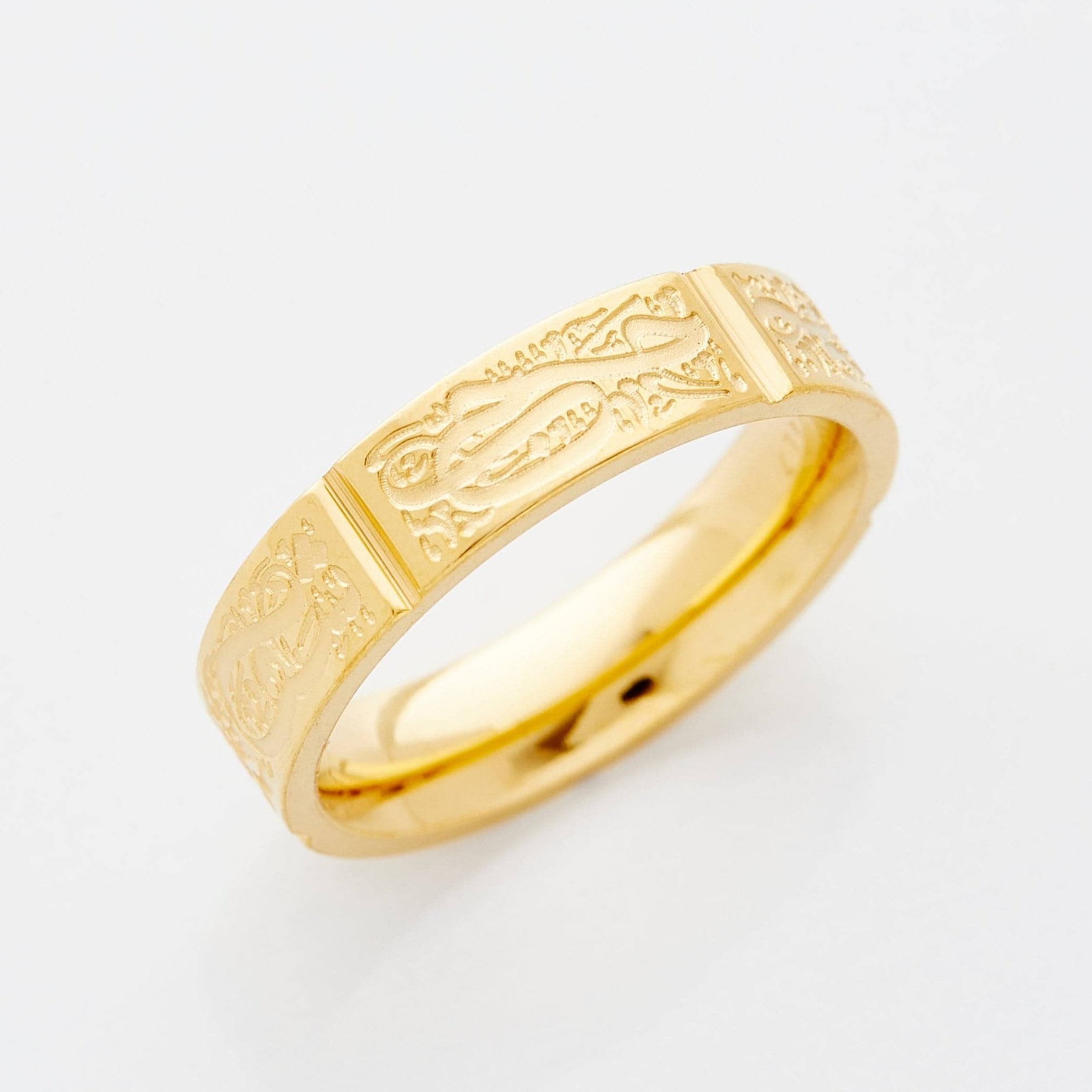 Close-up view of the Five Pillars Engraved Ring highlighting Arabic inscriptions.