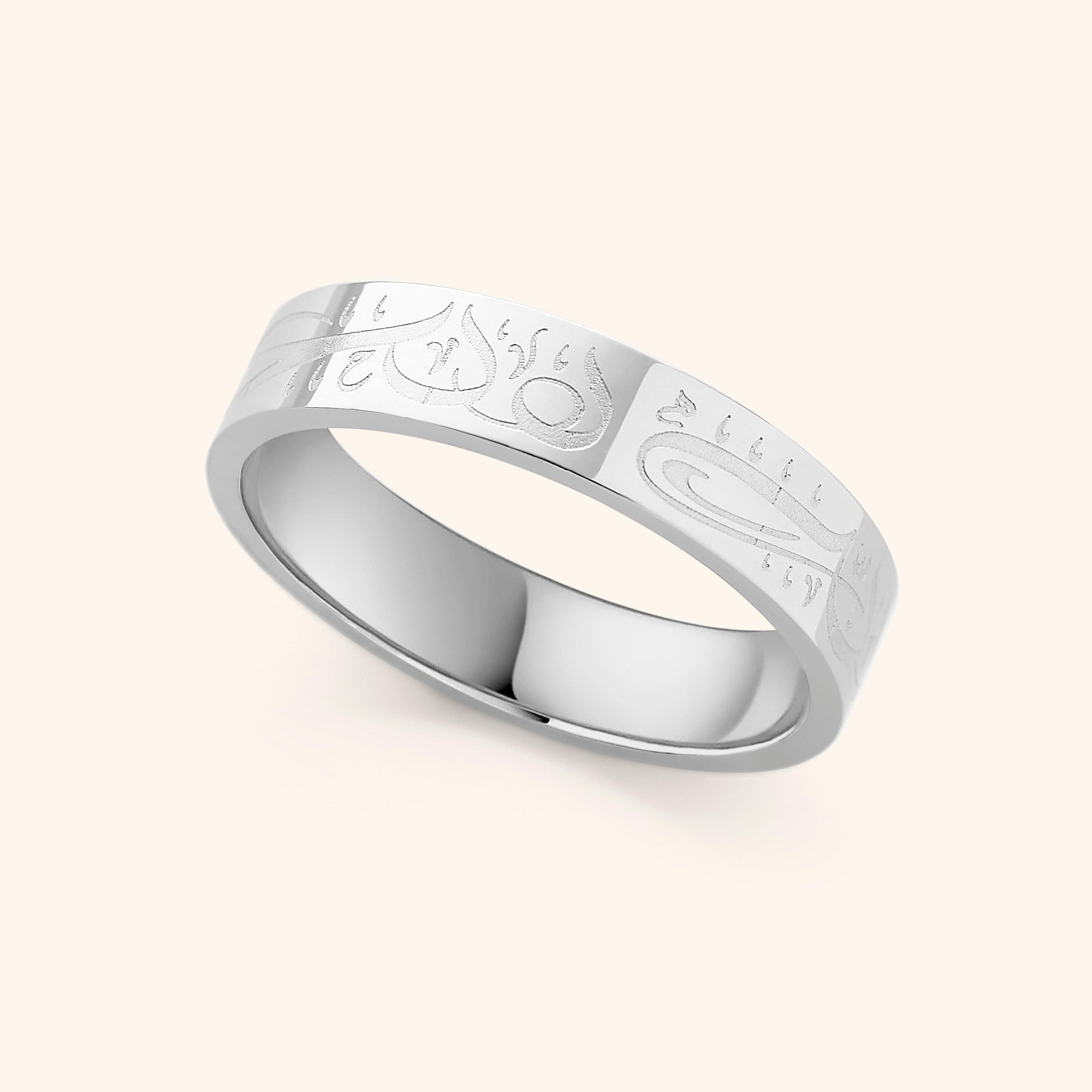 Model wearing womens calligraphy ring with engraved design, showcasing versatile everyday styling
