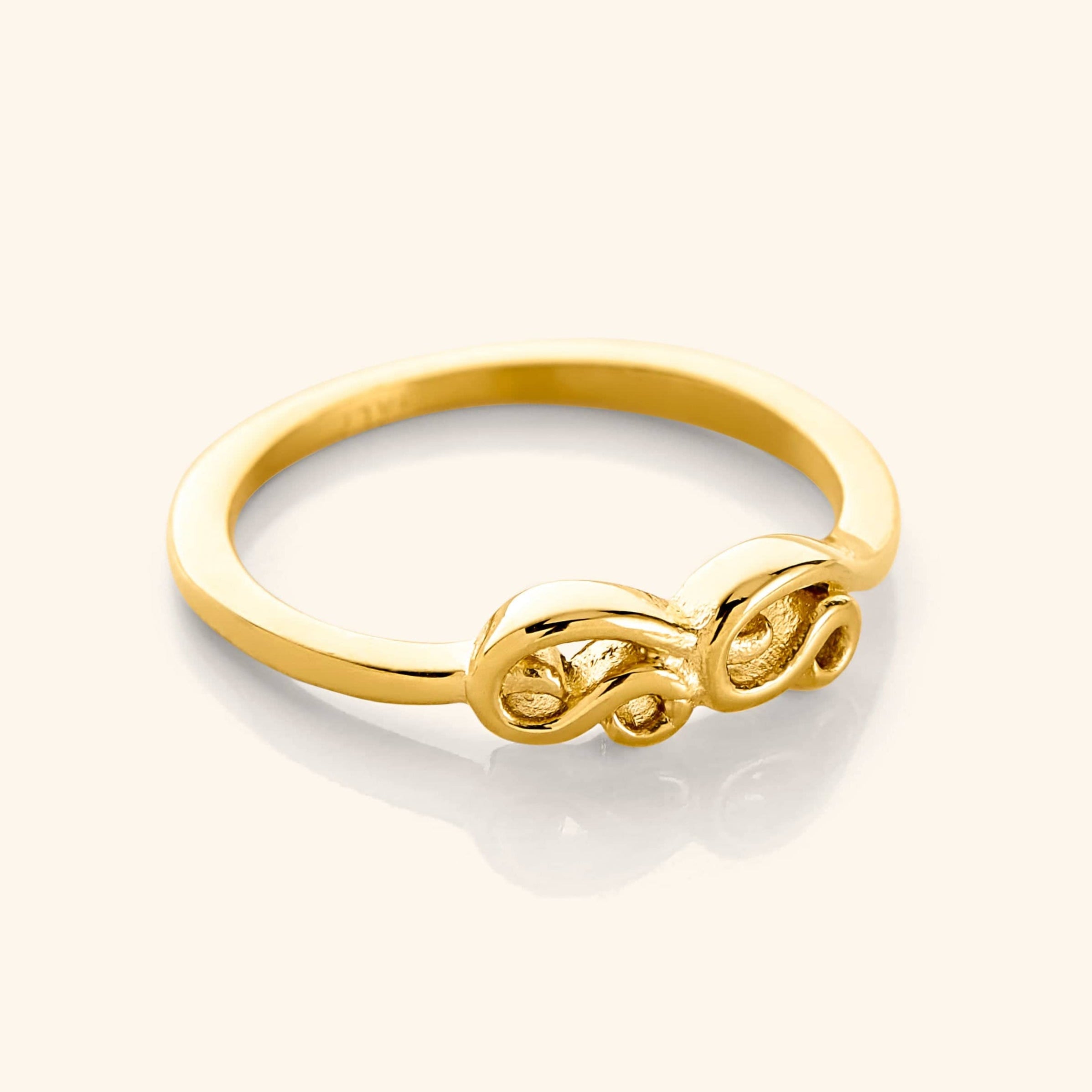 Elegant Arabic Mama Ring showcasing intricate design and shine.