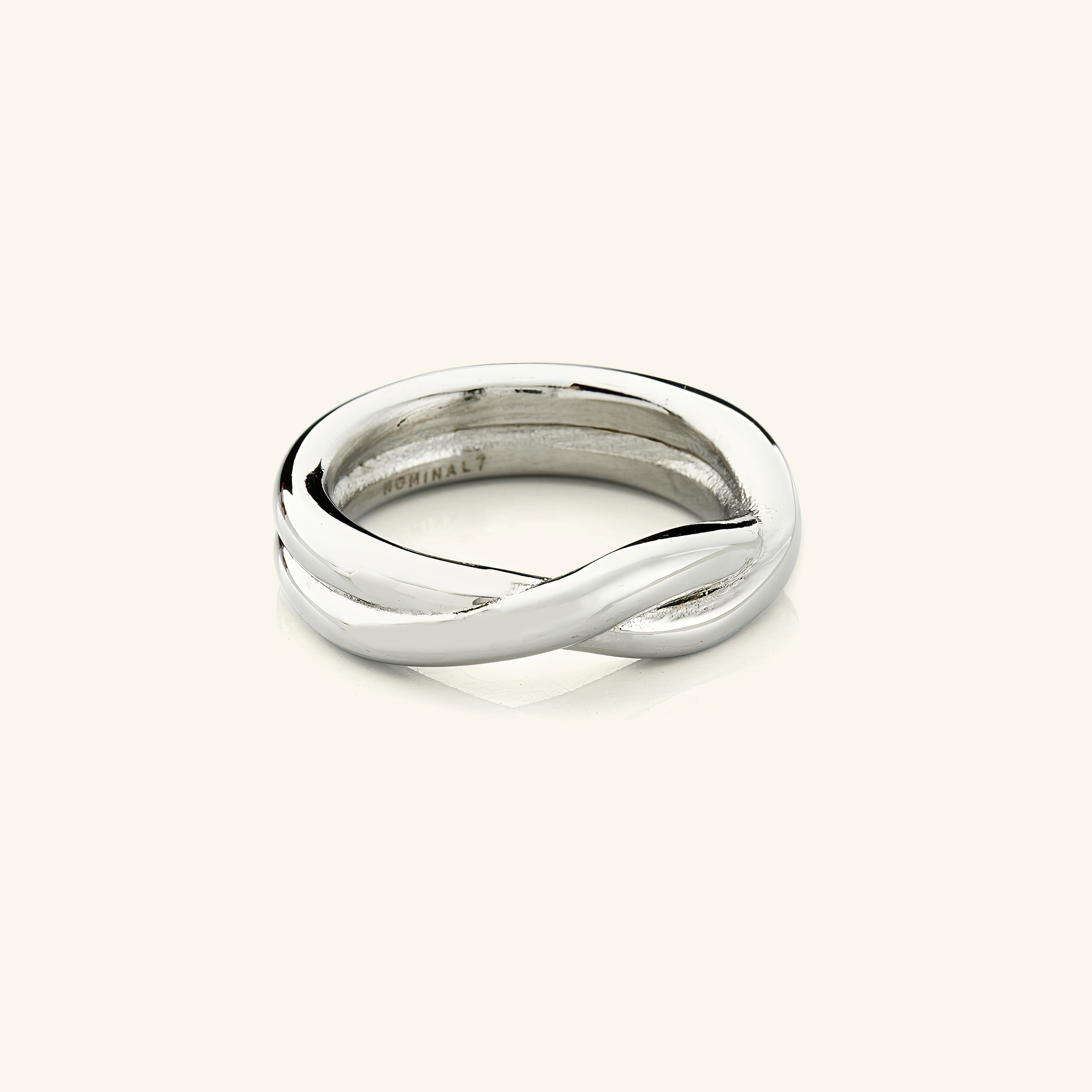 Intertwined Love Couple Rings displayed elegantly in Nominal pouch.