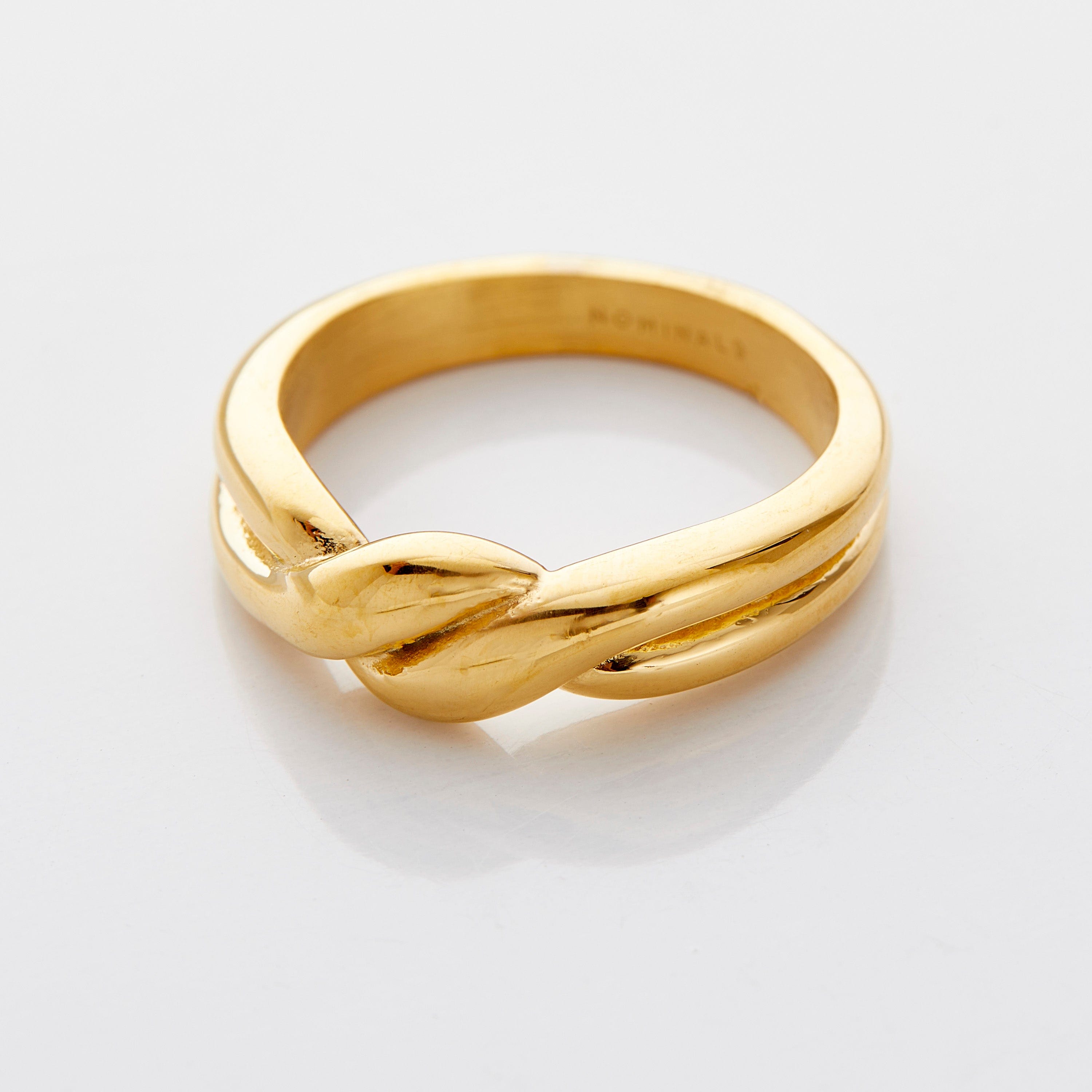 Close-up of the eternal knot commitment ring showcasing its intricate design.