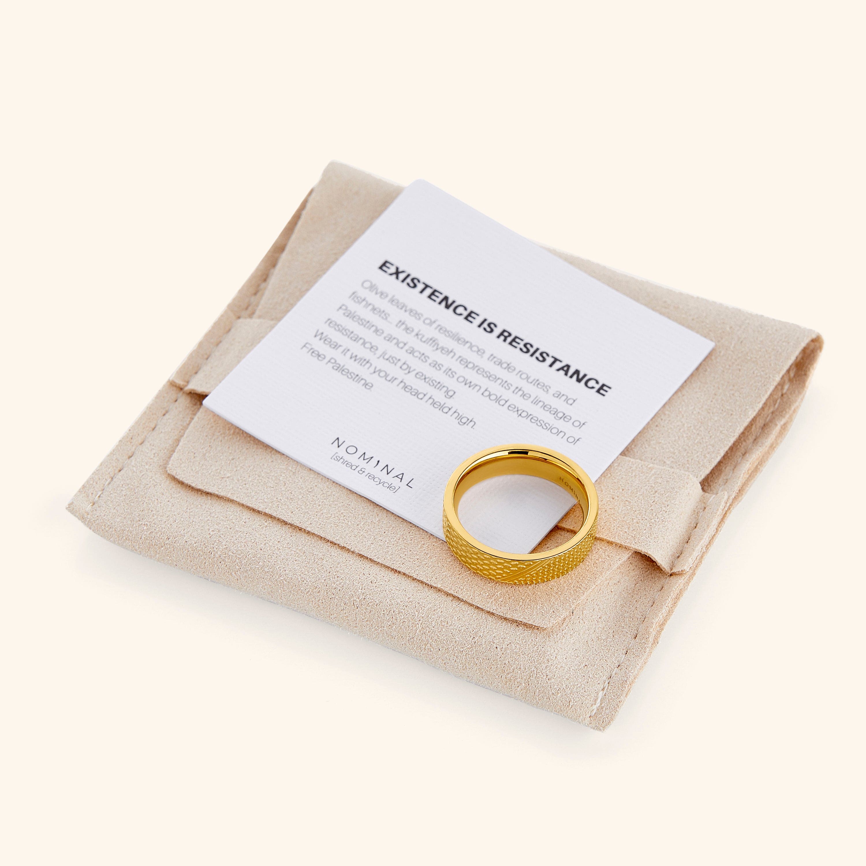 Keffiyeh ring displayed in a velvet pouch, emphasizing its unique heritage gift qualities.