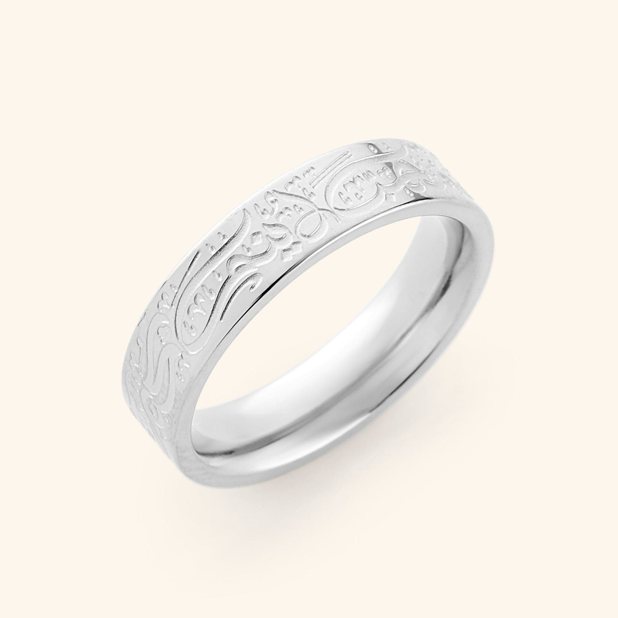 Close-up of the Rumi love quote ring on a hand, showcasing its elegant design.
