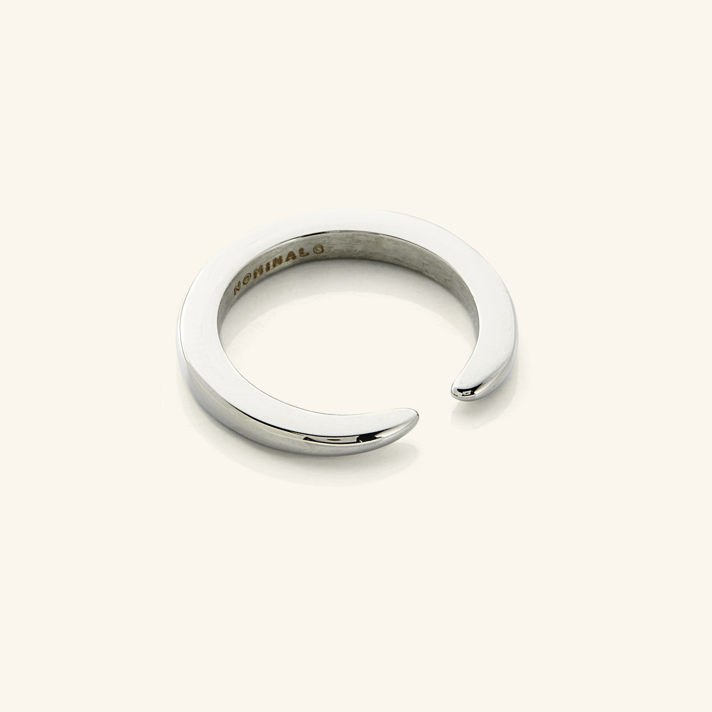 Stacked view of the open gap gold ring paired with other stackable rings.