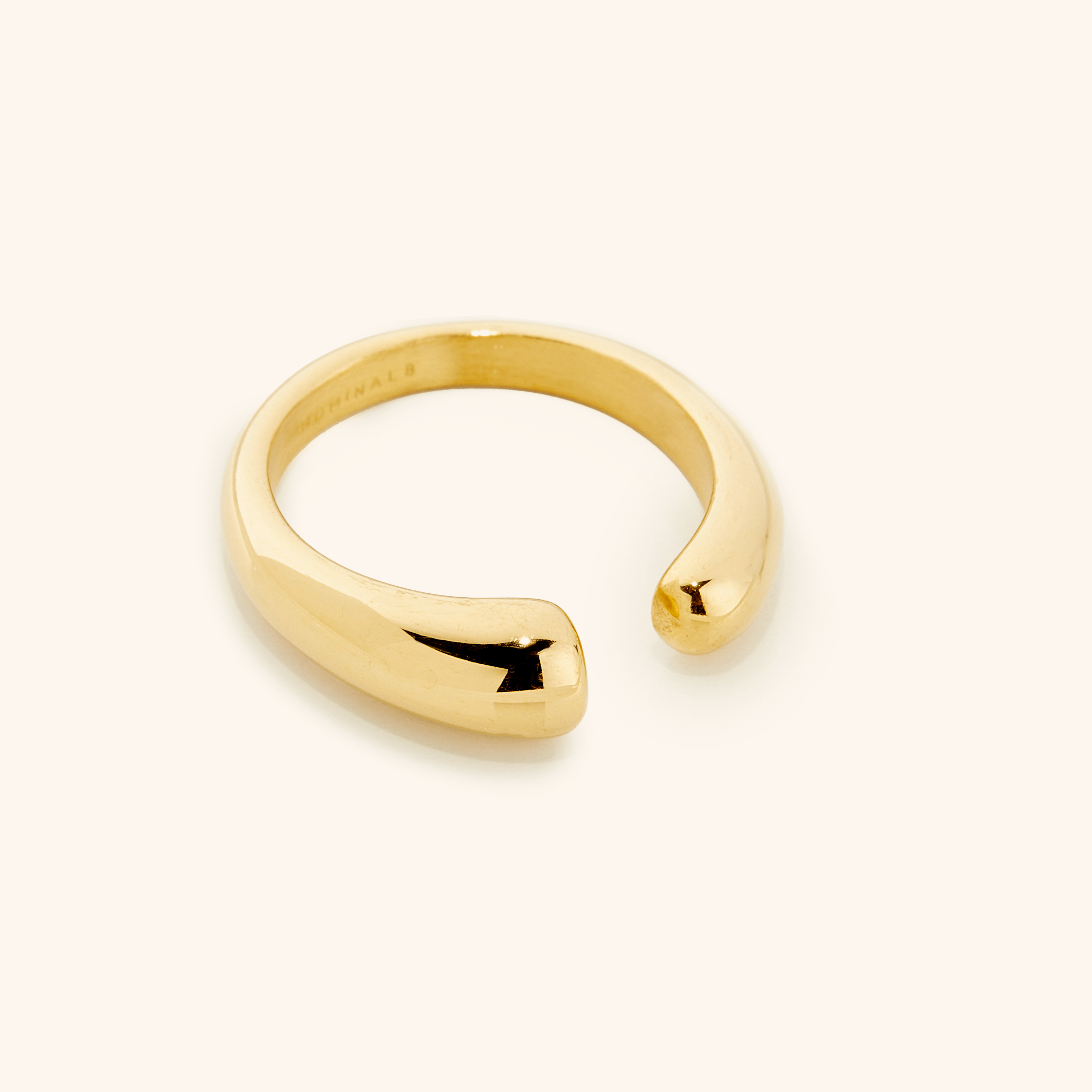 Aurora Curve ring front view showcasing the open gold band design.