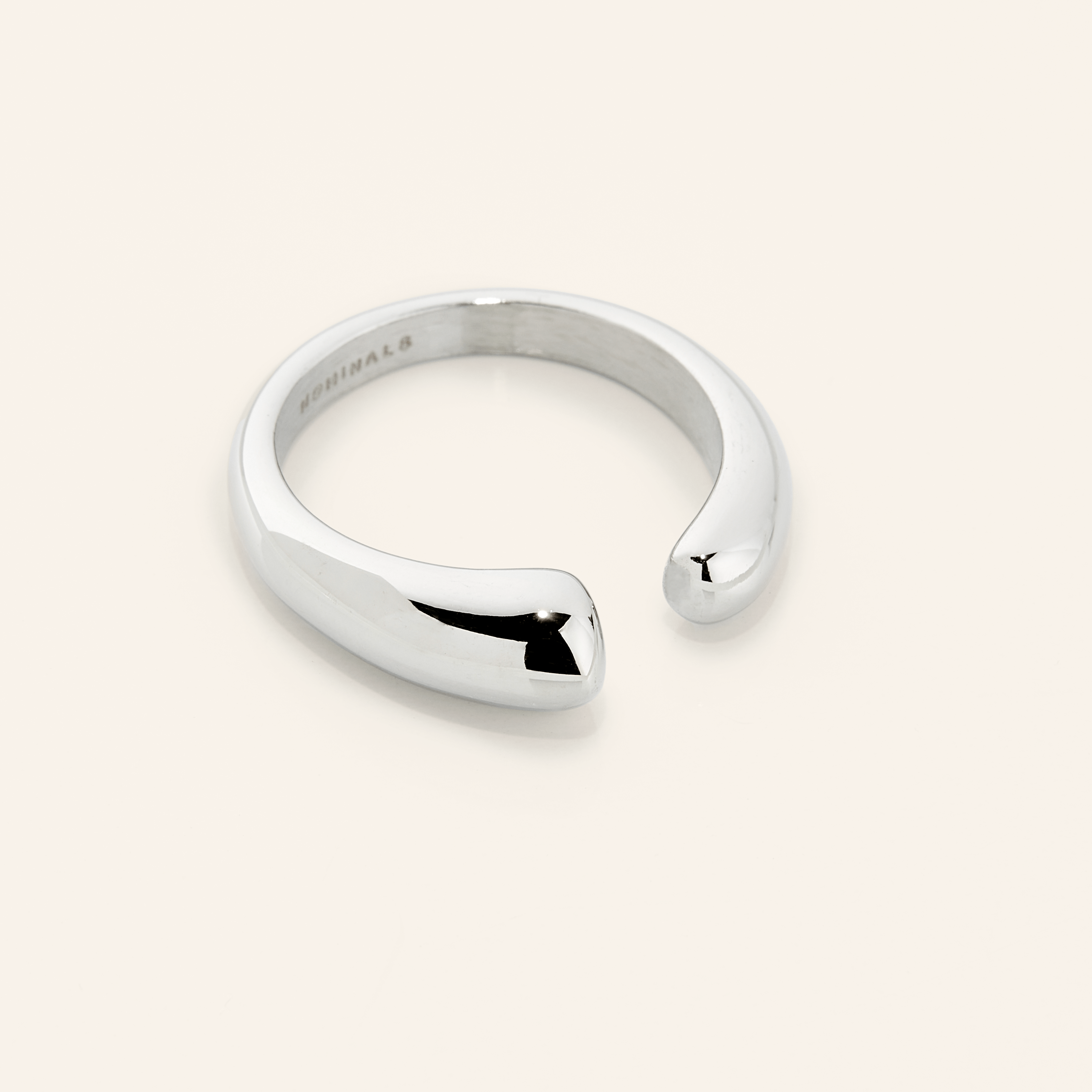 Lifestyle image of Aurora Curve worn alone as a statement piece.