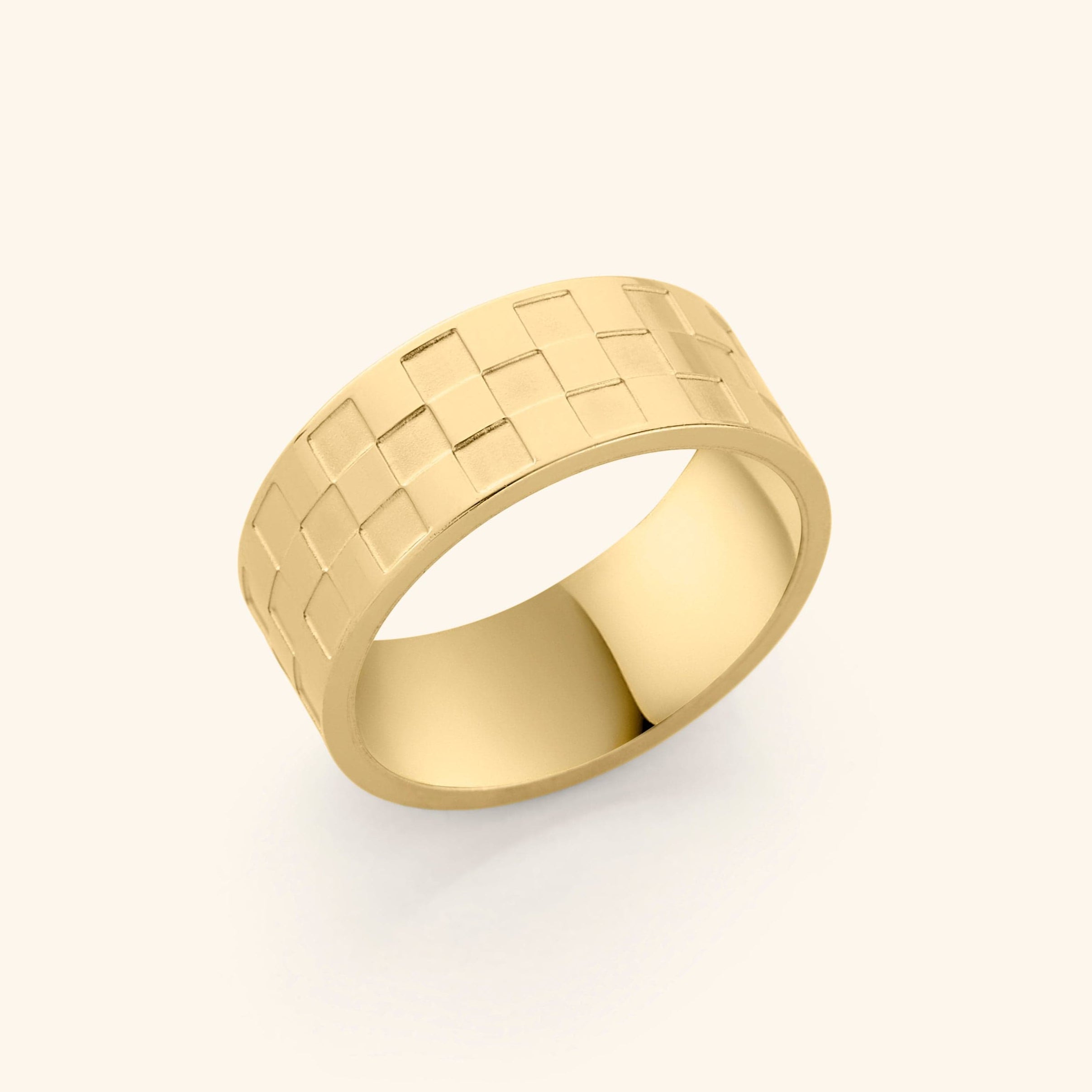 Queen's Chess Ring showcasing its elegant design and gold plating from a side angle.