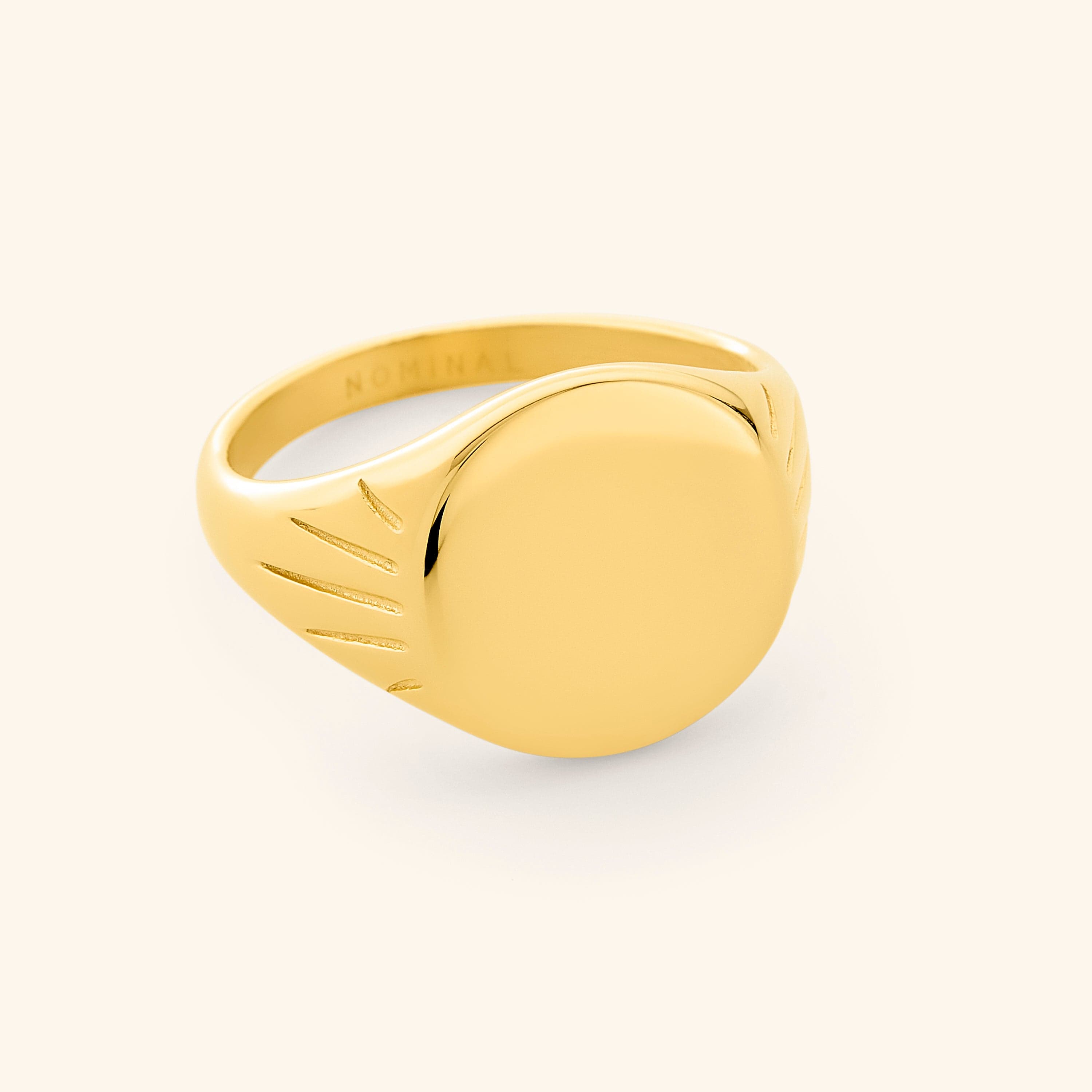 Radiant Sun Signet Ring from the top angle, highlighting its debossed sun pattern.