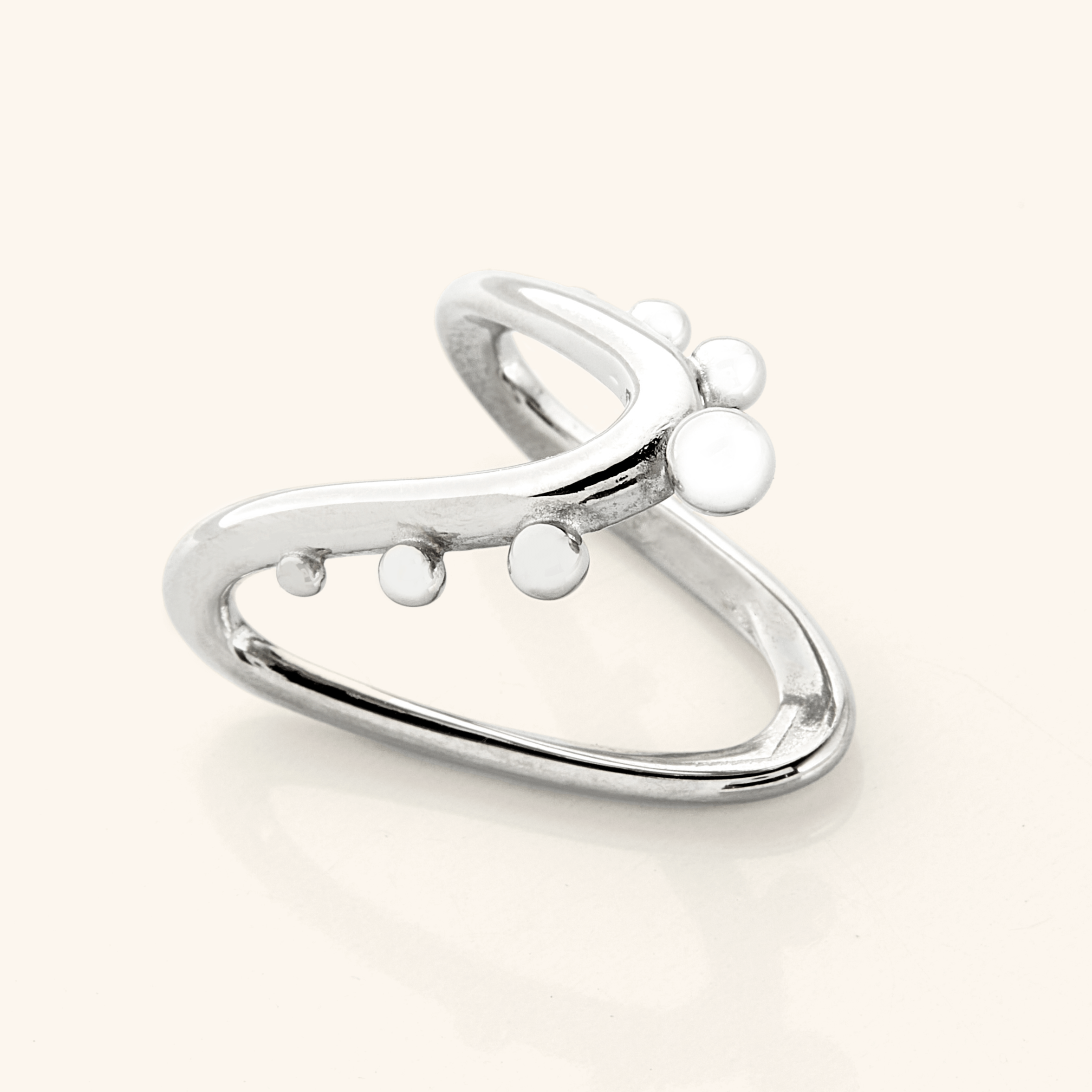 Close-up of the Celestial Harmony Ring on a models hand, emphasizing its beauty and shine.