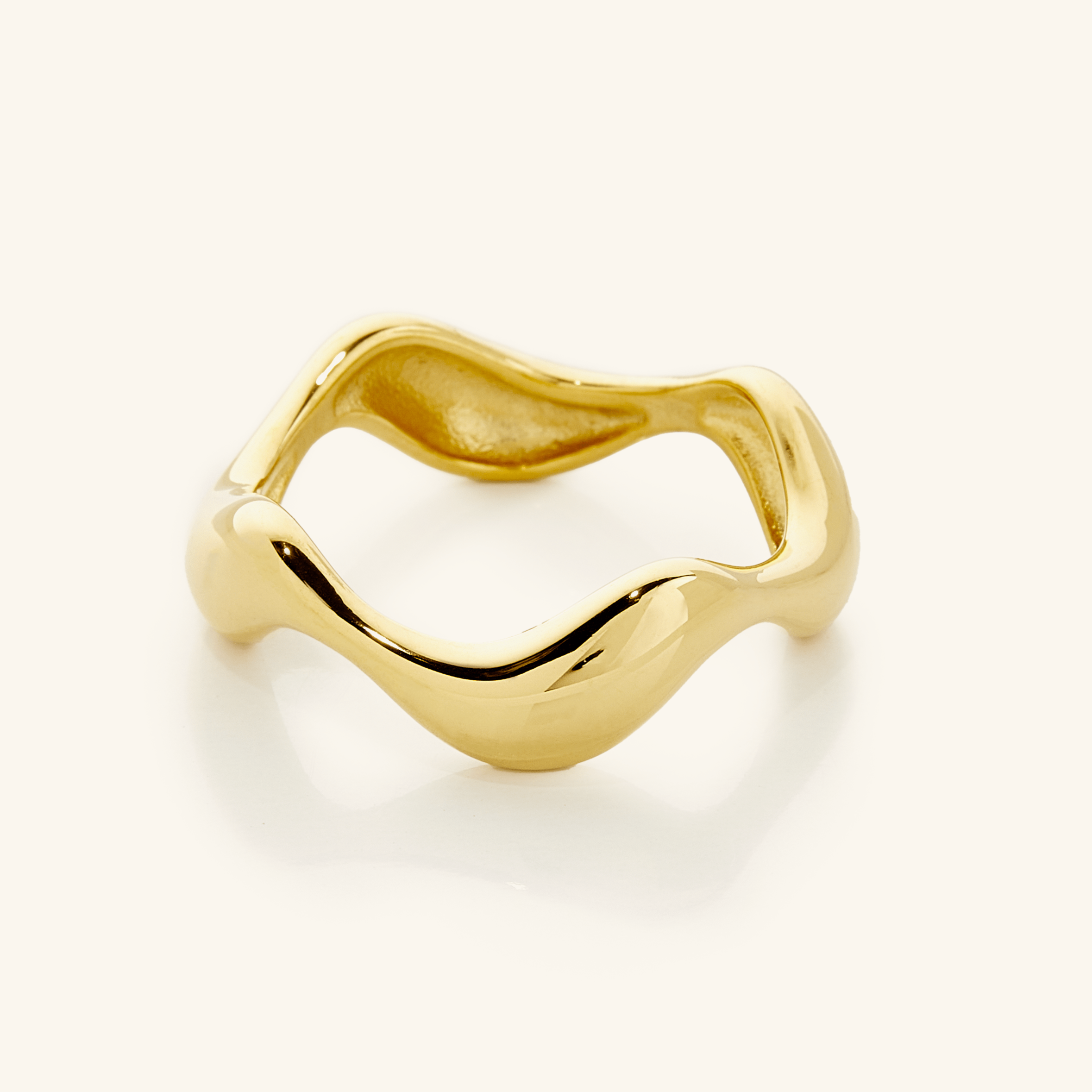 Oceanic Wave Gold Ring viewed from the side, showcasing its unique wave design and gold shine.