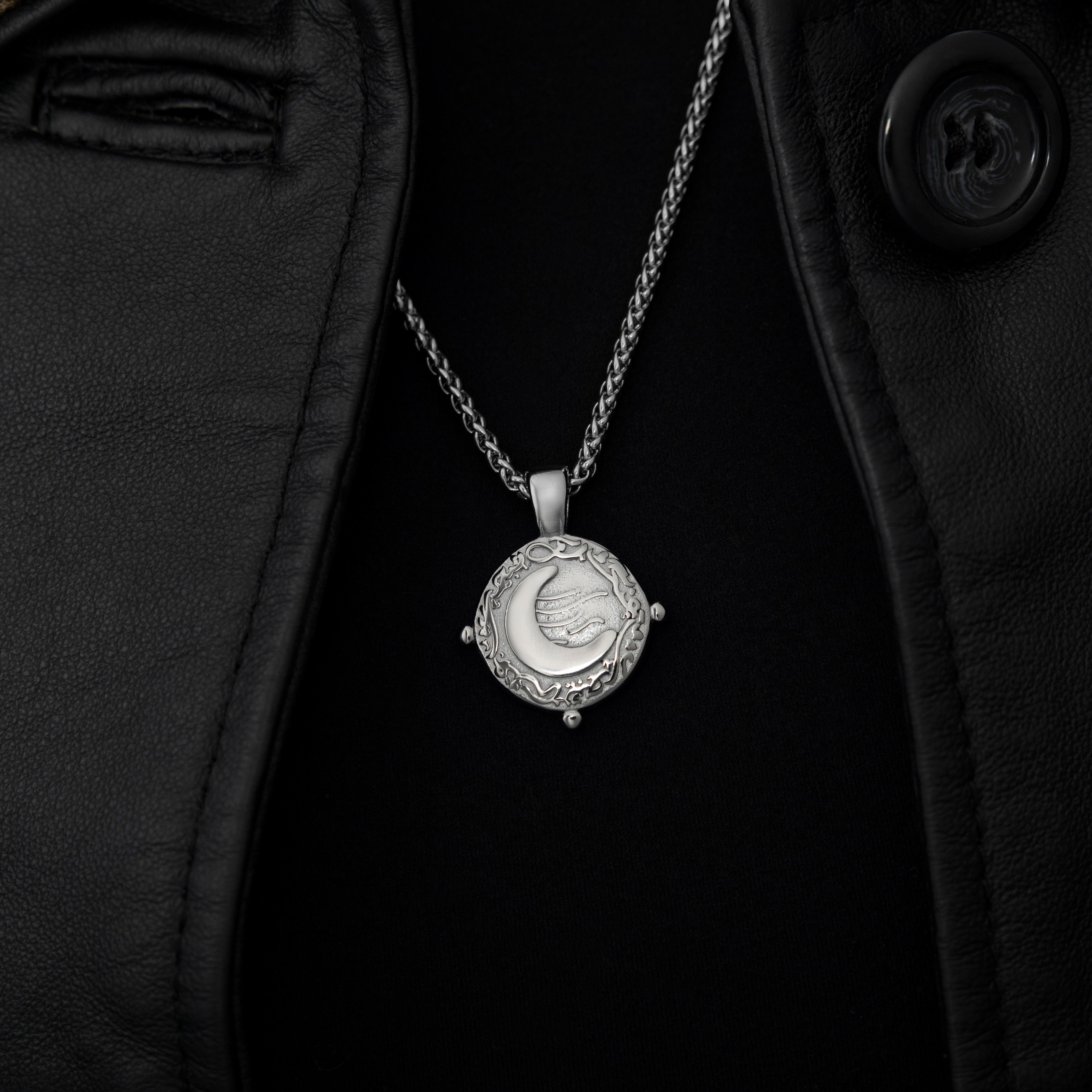 Close-up view of the vintage gold crescent necklace showcasing the Arabic pendant.