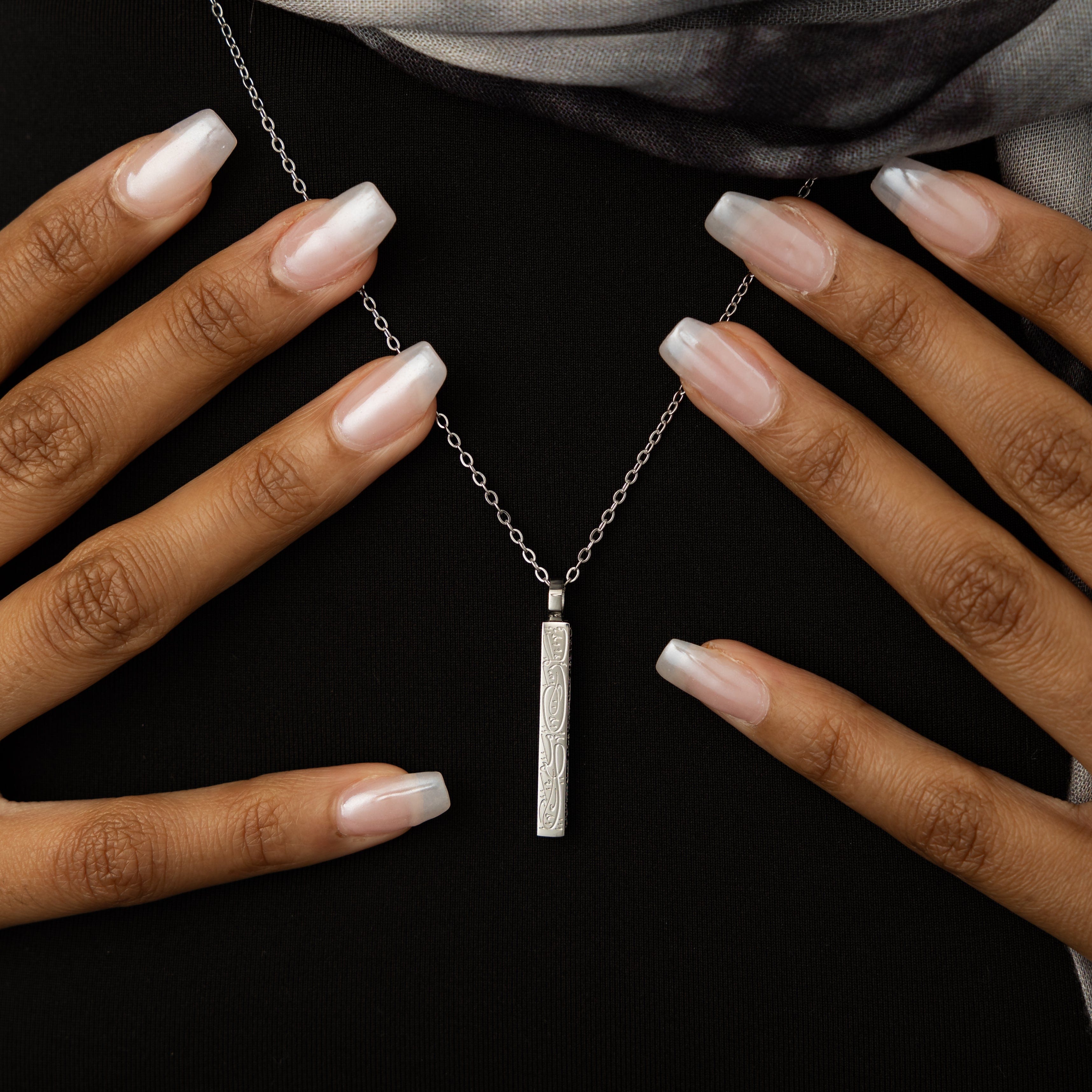 Close-up of the Resilient Spirit Bar Necklace showcasing the intricate engraving of Quran verse.