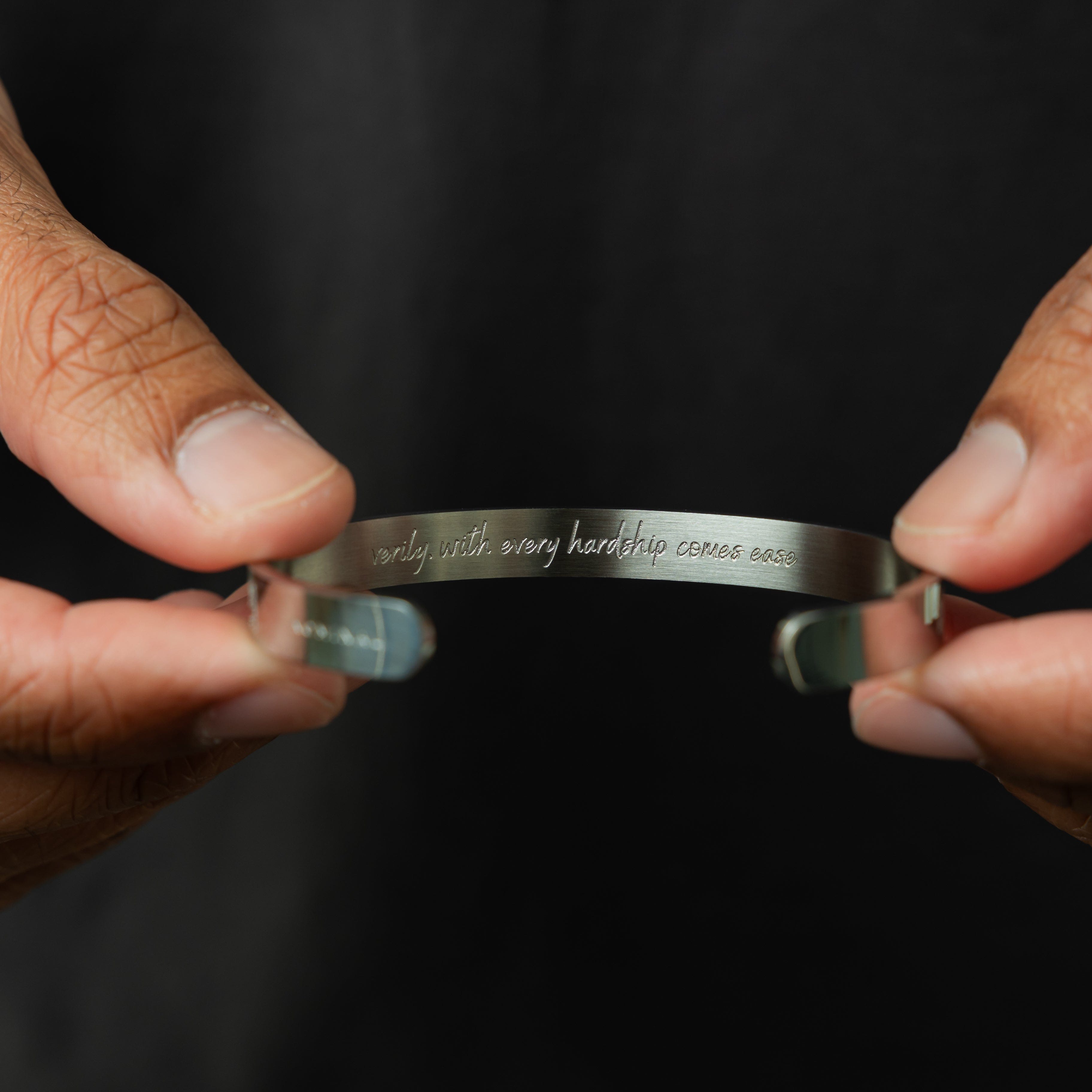 Ease & Strength stainless steel adjustable cuff for men displayed on a wrist