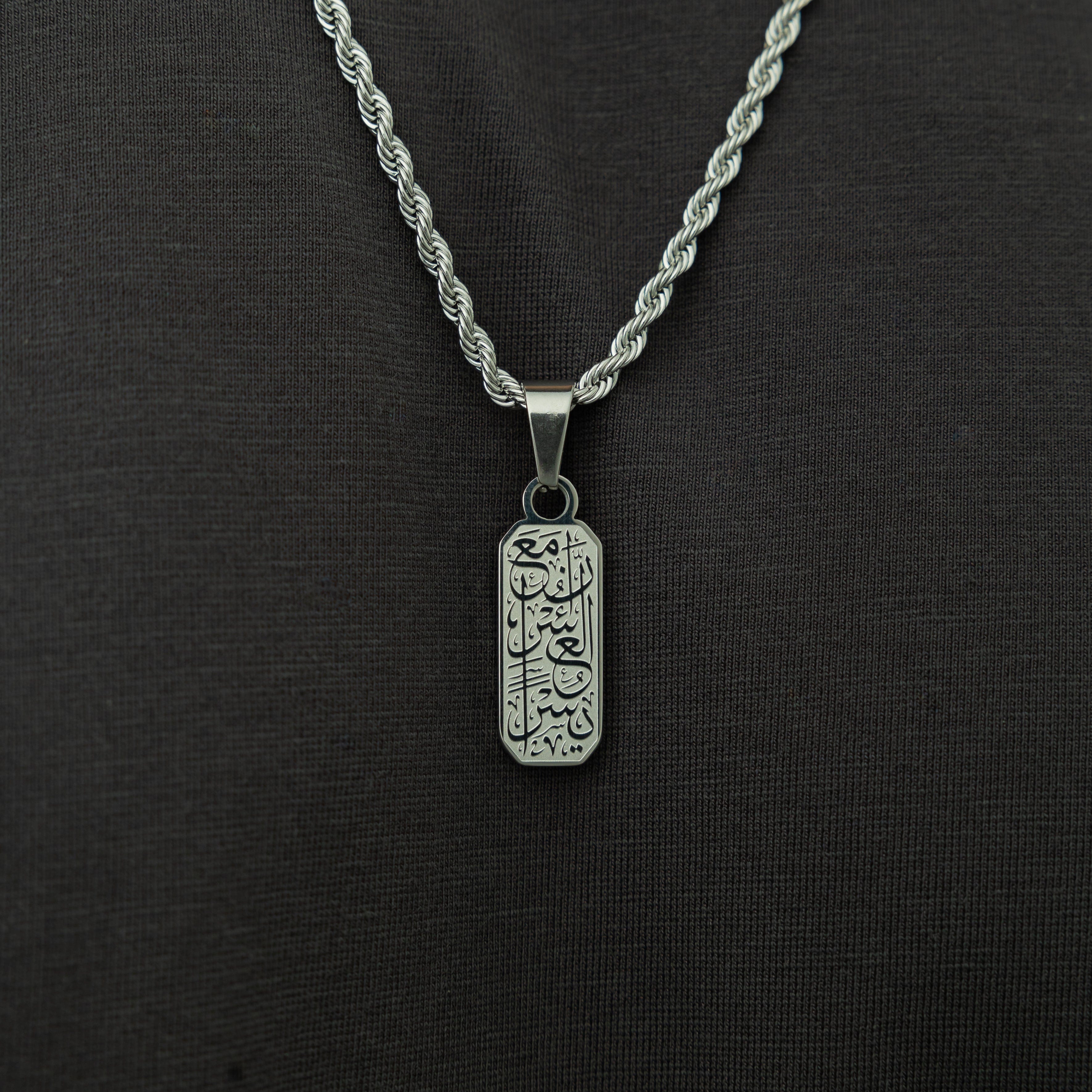 Men wearing the engraved pendant with a casual outfit, emphasizing its style and versatility.