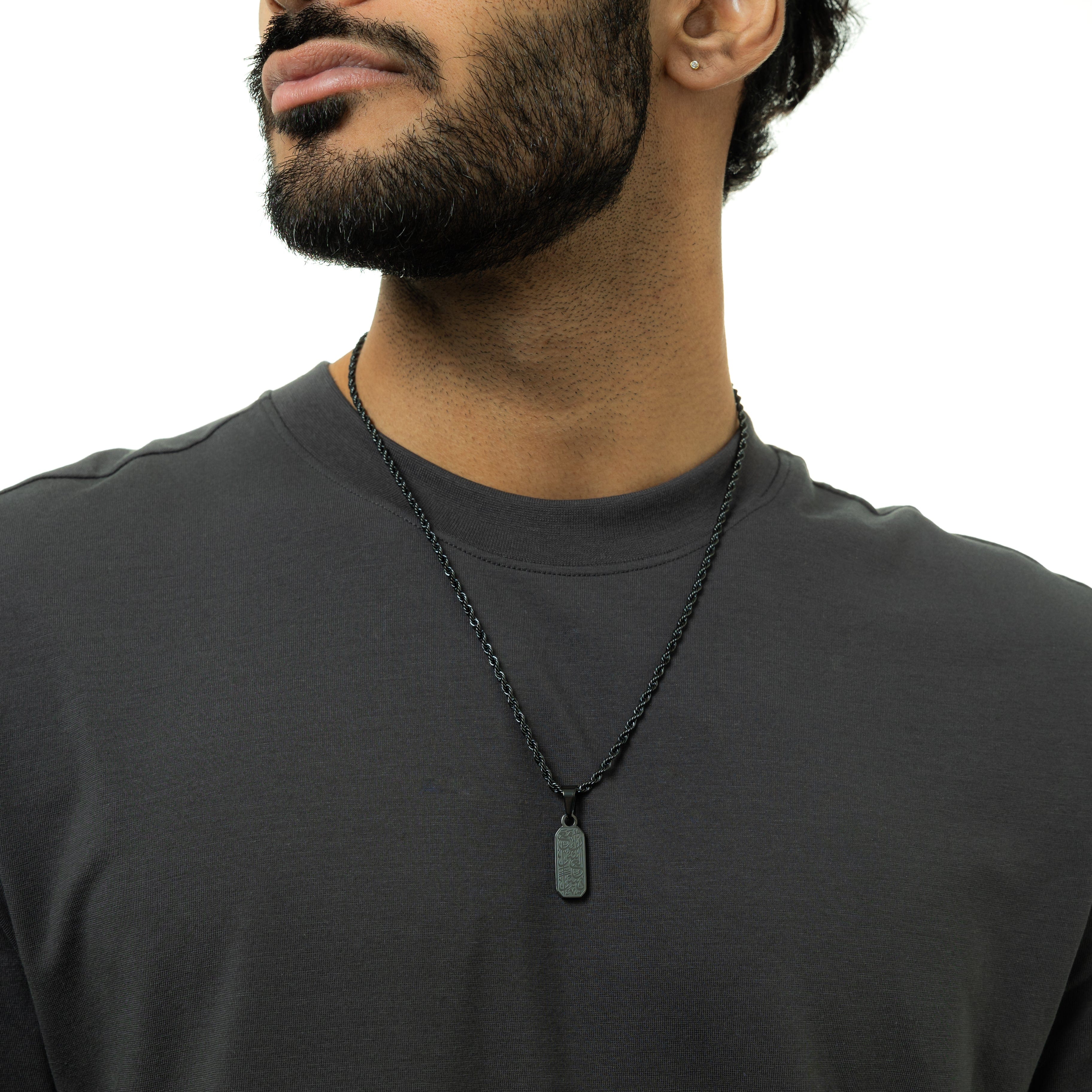 Close-up view of the engraved pendant showcasing its intricate design and message.