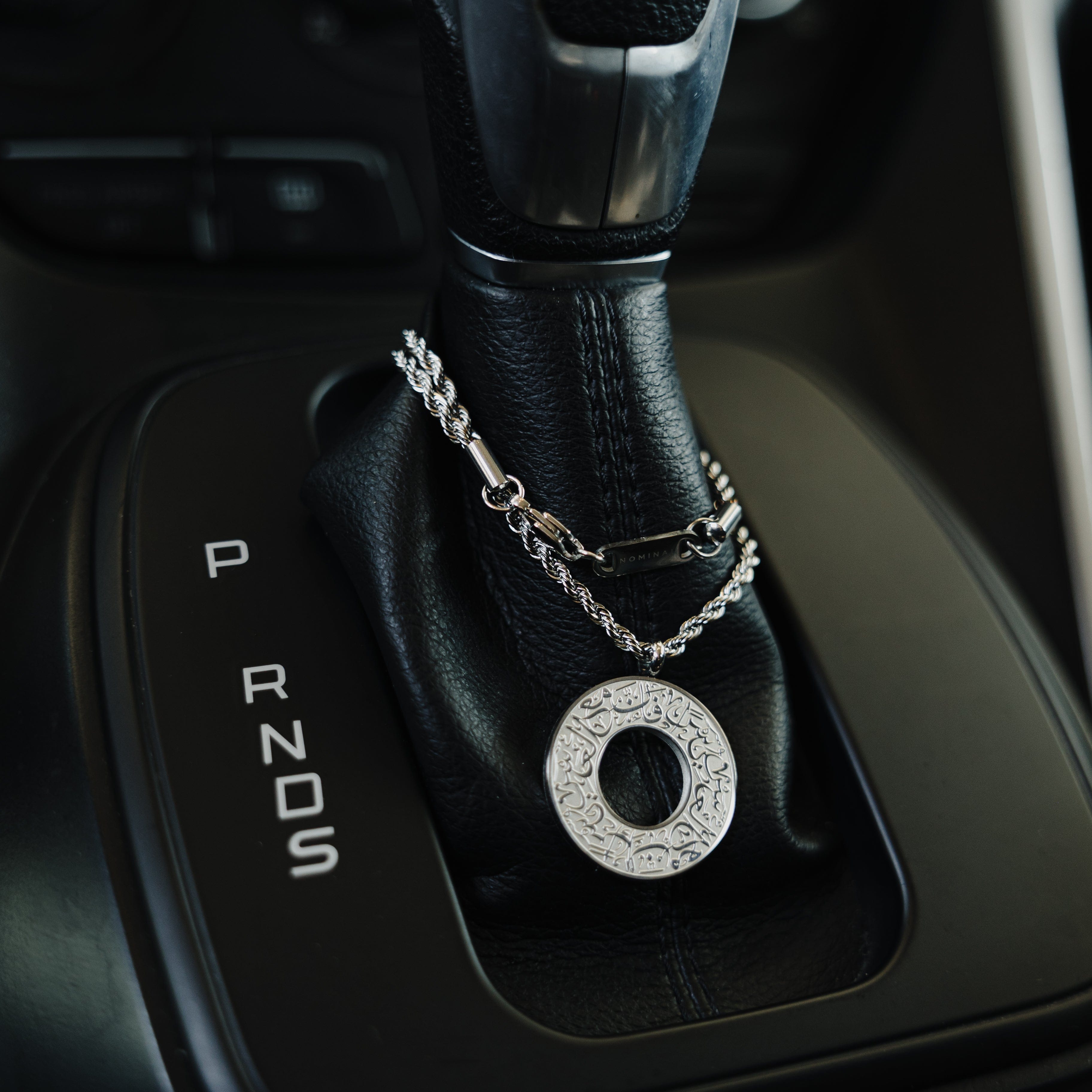 Stylish car hanger in a velvet pouch, ideal for gifting or personal use with a motivational flair.