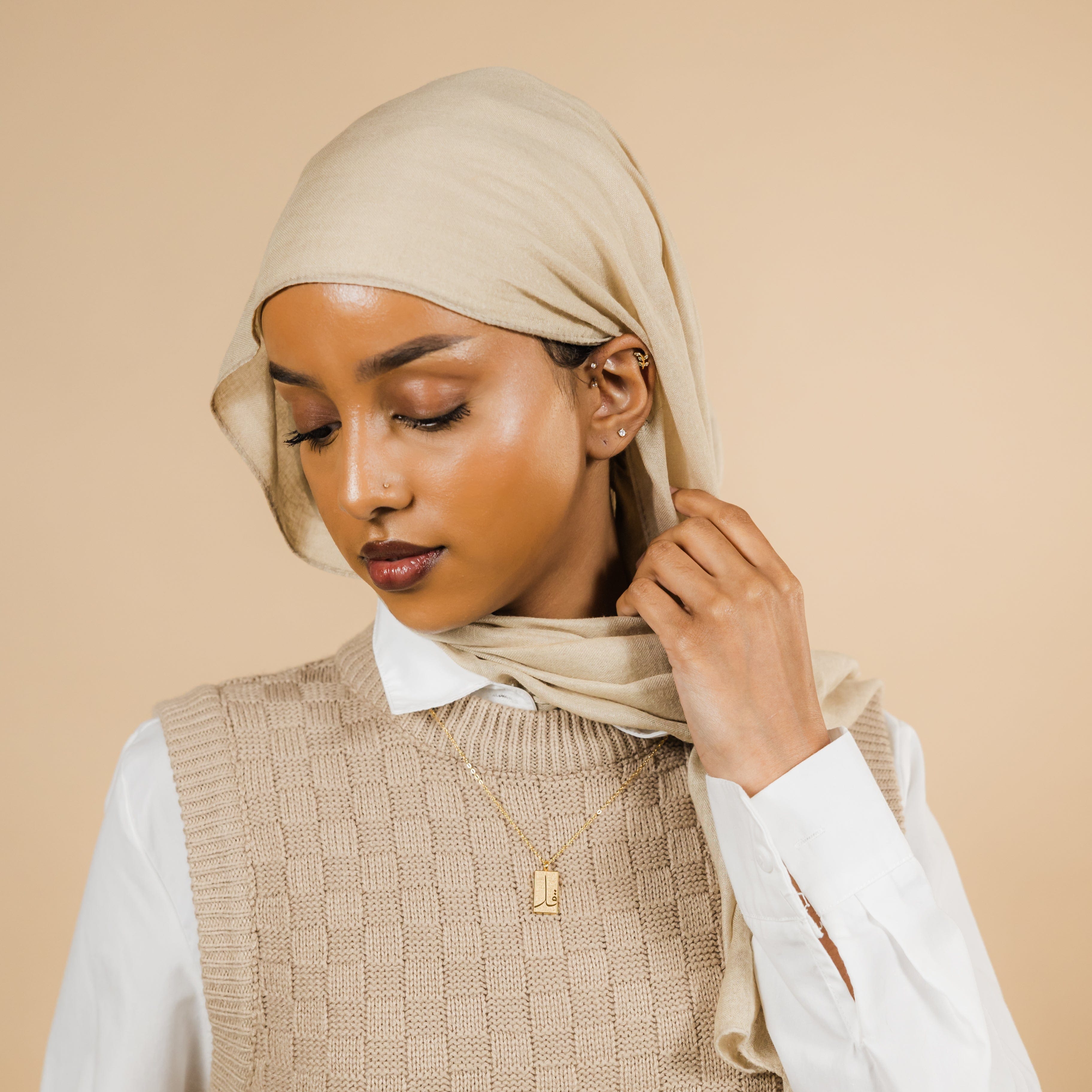 Close-up of the elegant 4 Qul waterproof Quran necklace for women, showcasing the intricate design