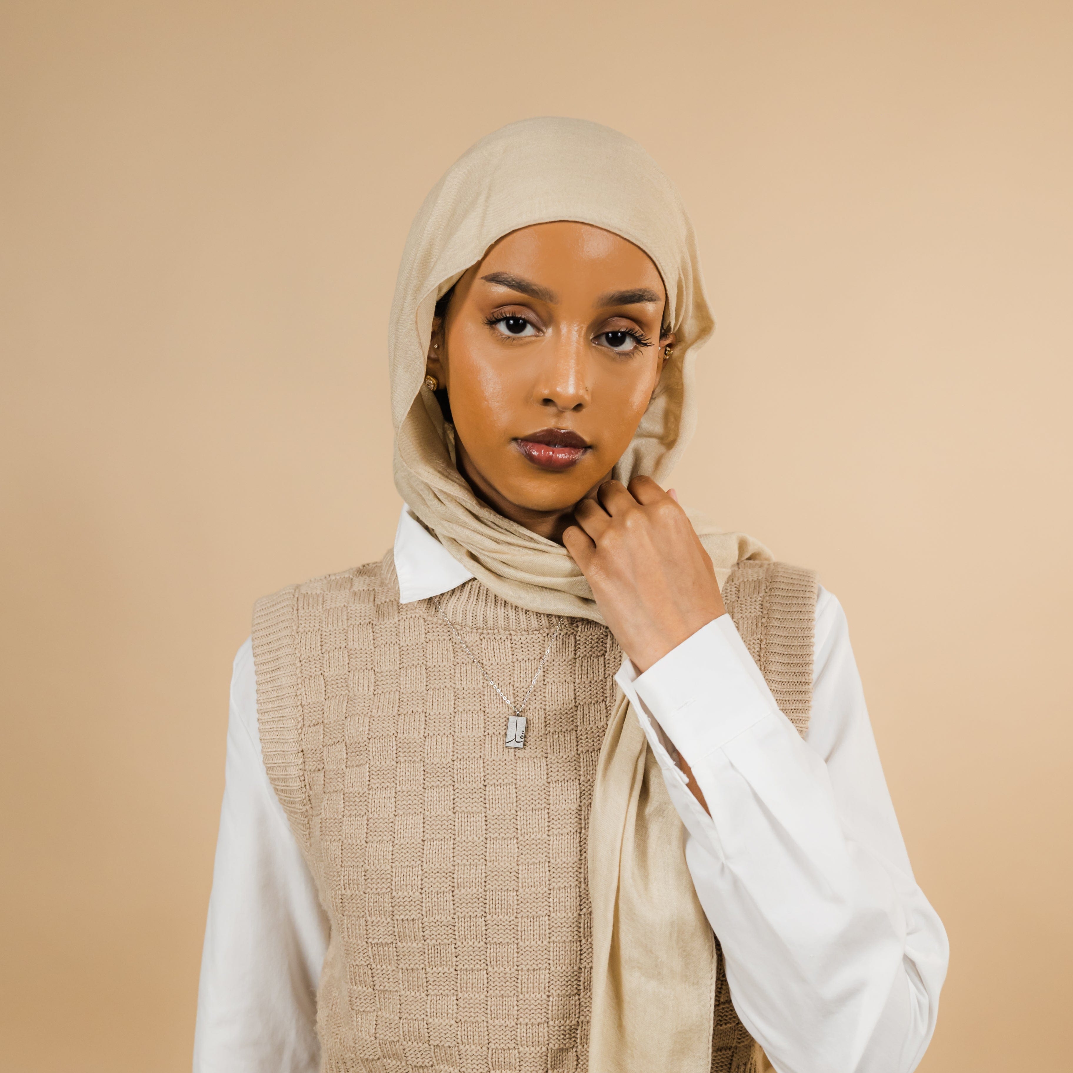 Model wearing the waterproof Quran necklace, displaying its adjustable length and elegance