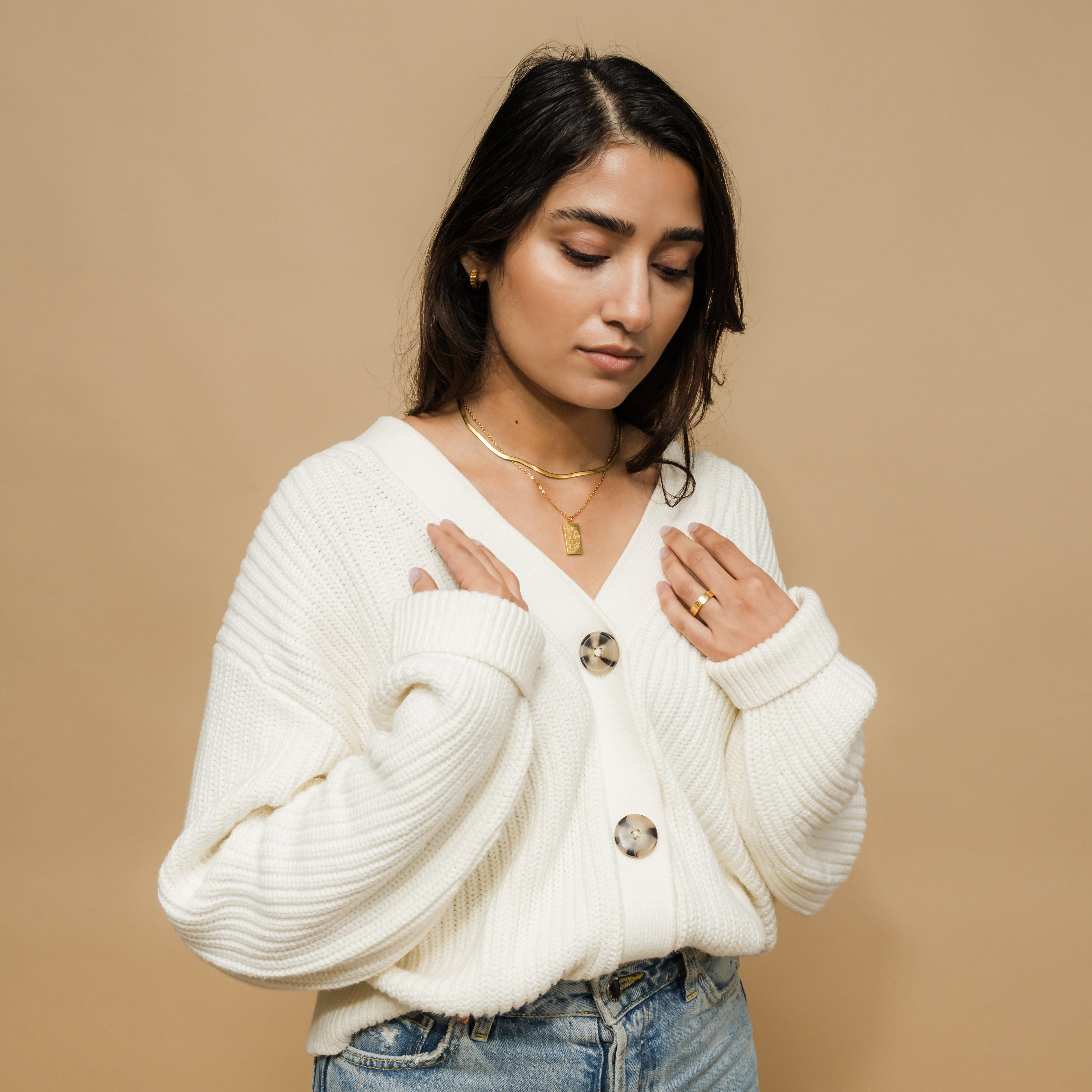 Couples wearing matching necklaces, emphasizing love and connection.